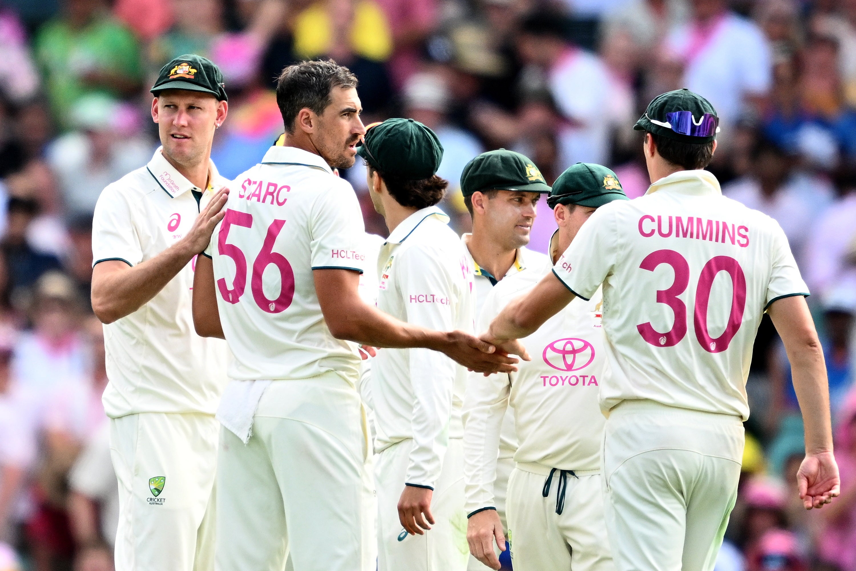 Mitchell Starc of Australia celebrates with teammates