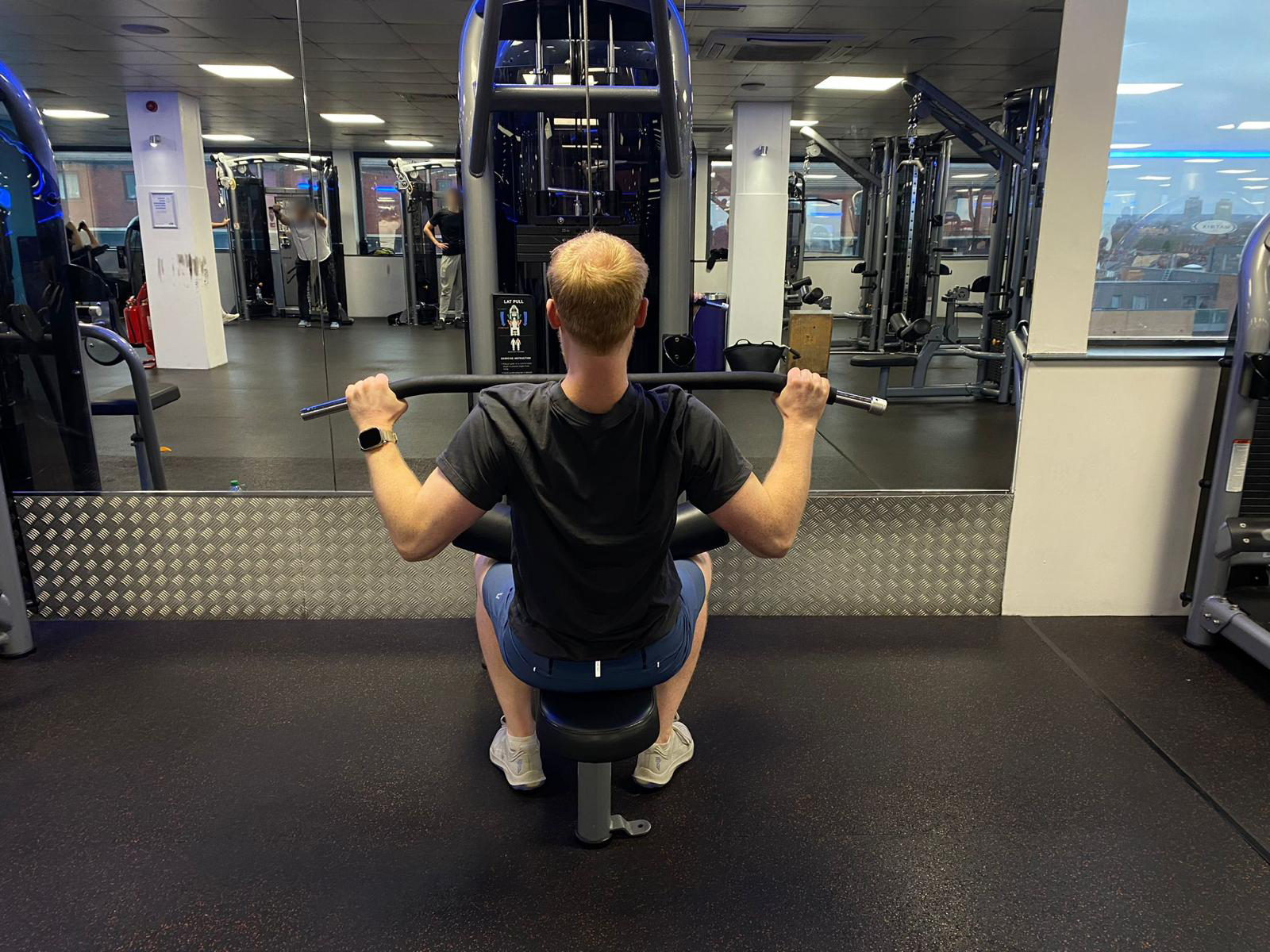 The Independent’s fitness writer Harry Bullmore performing a lat pulldown