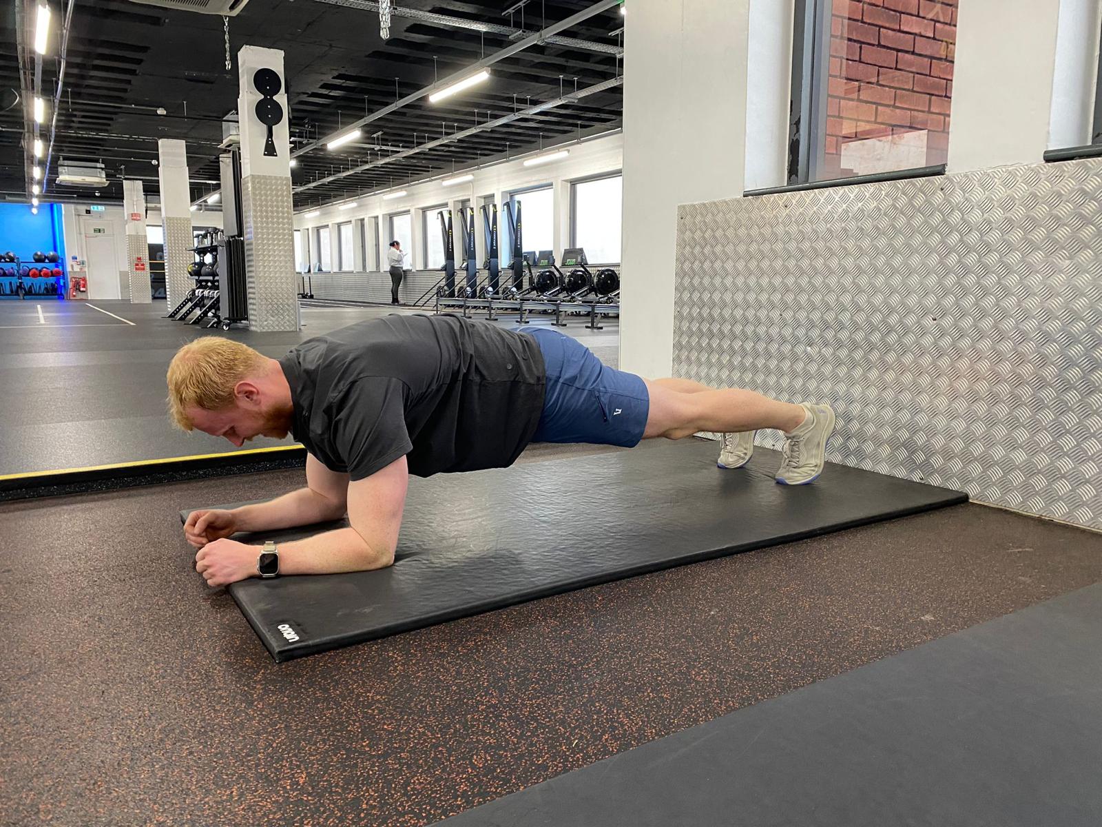 Demonstrating a plank hold