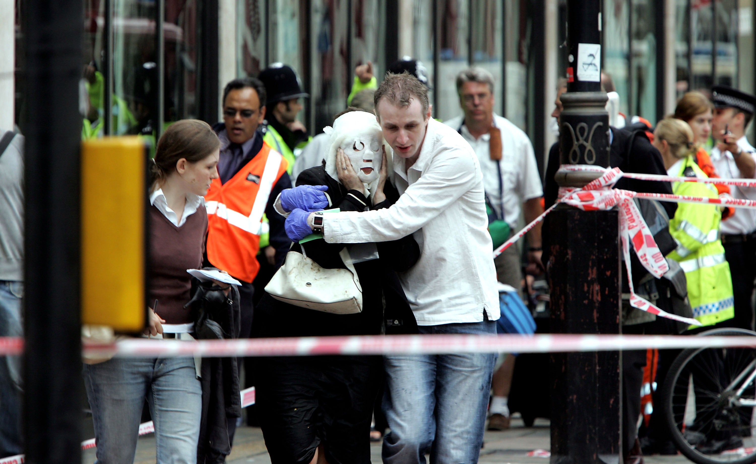 A victim of the Edgware Road blast is taken away from the scene