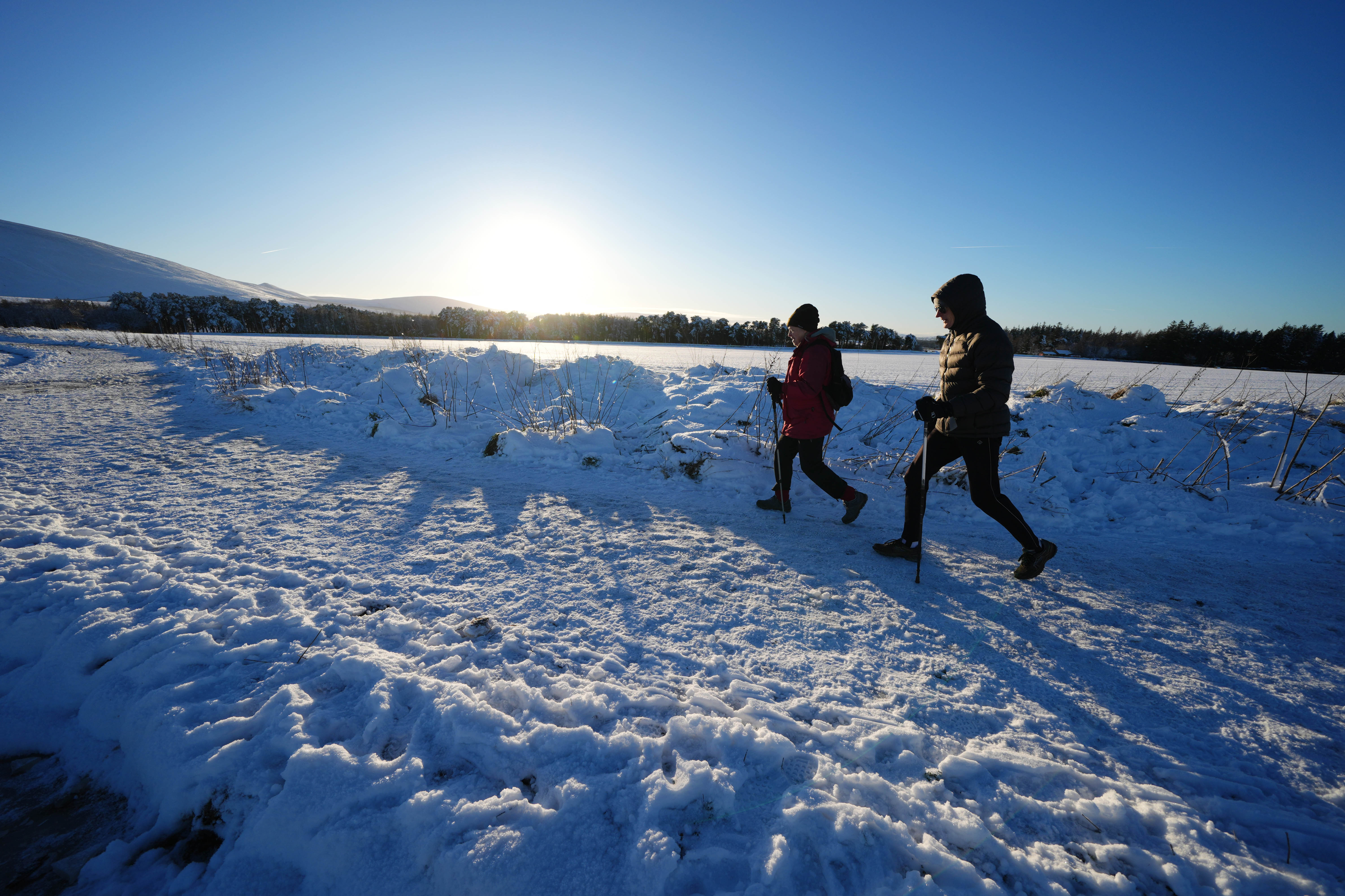 Walkers in the Pentland Hills, Edinburgh. The UK Health Security Agency has issued cold weather health alerts for all of England as snow is expected over much of the country