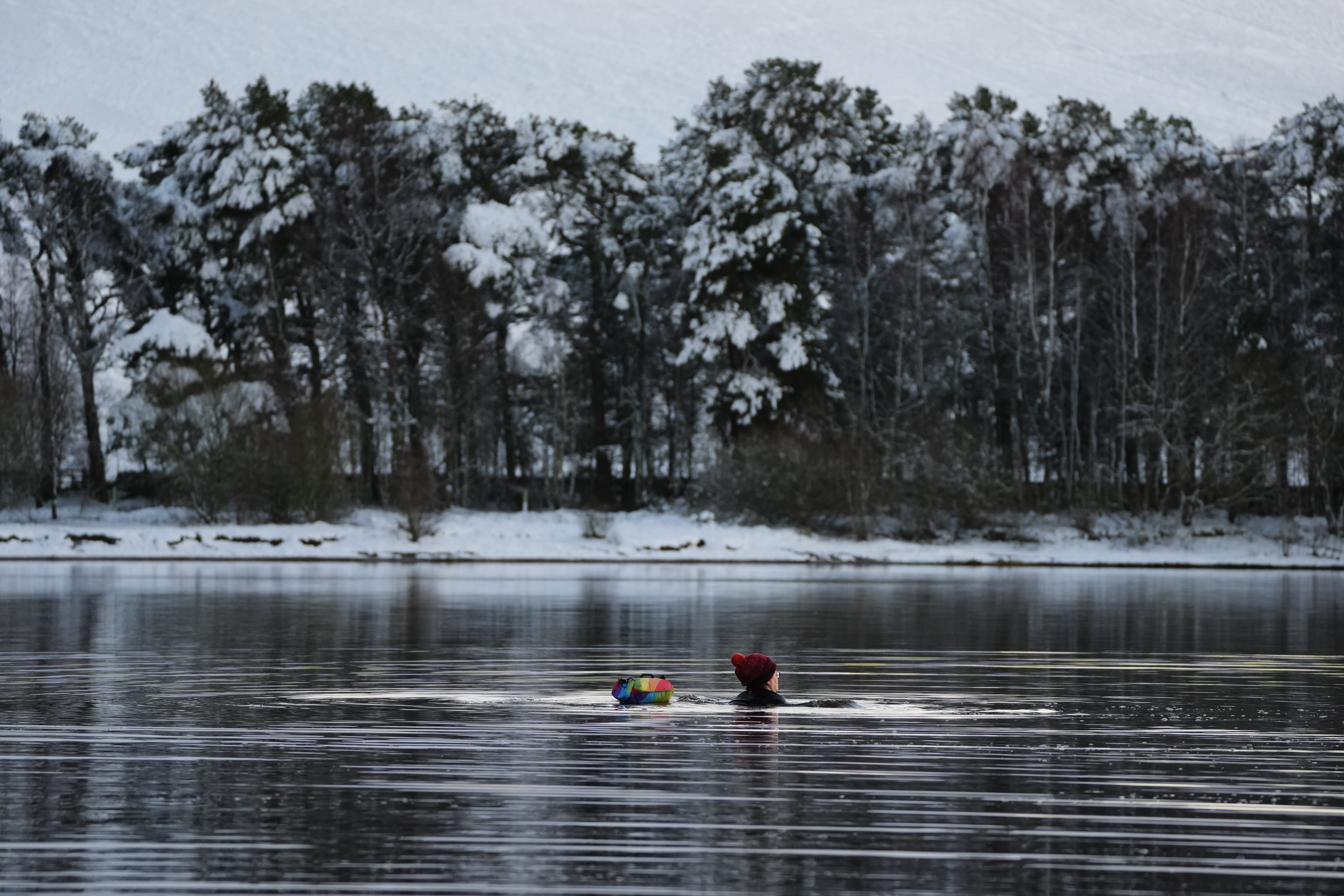 A swimmer braves the cold at Harlaw Reservoir in the Pentland Hills, Balerno, Edinburgh on Friday