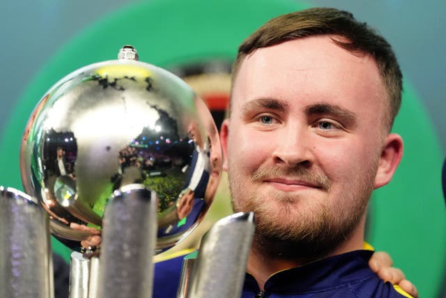 <p>Luke Littler with The Sid Waddell Trophy (Zac Goodwin/PA)</p>