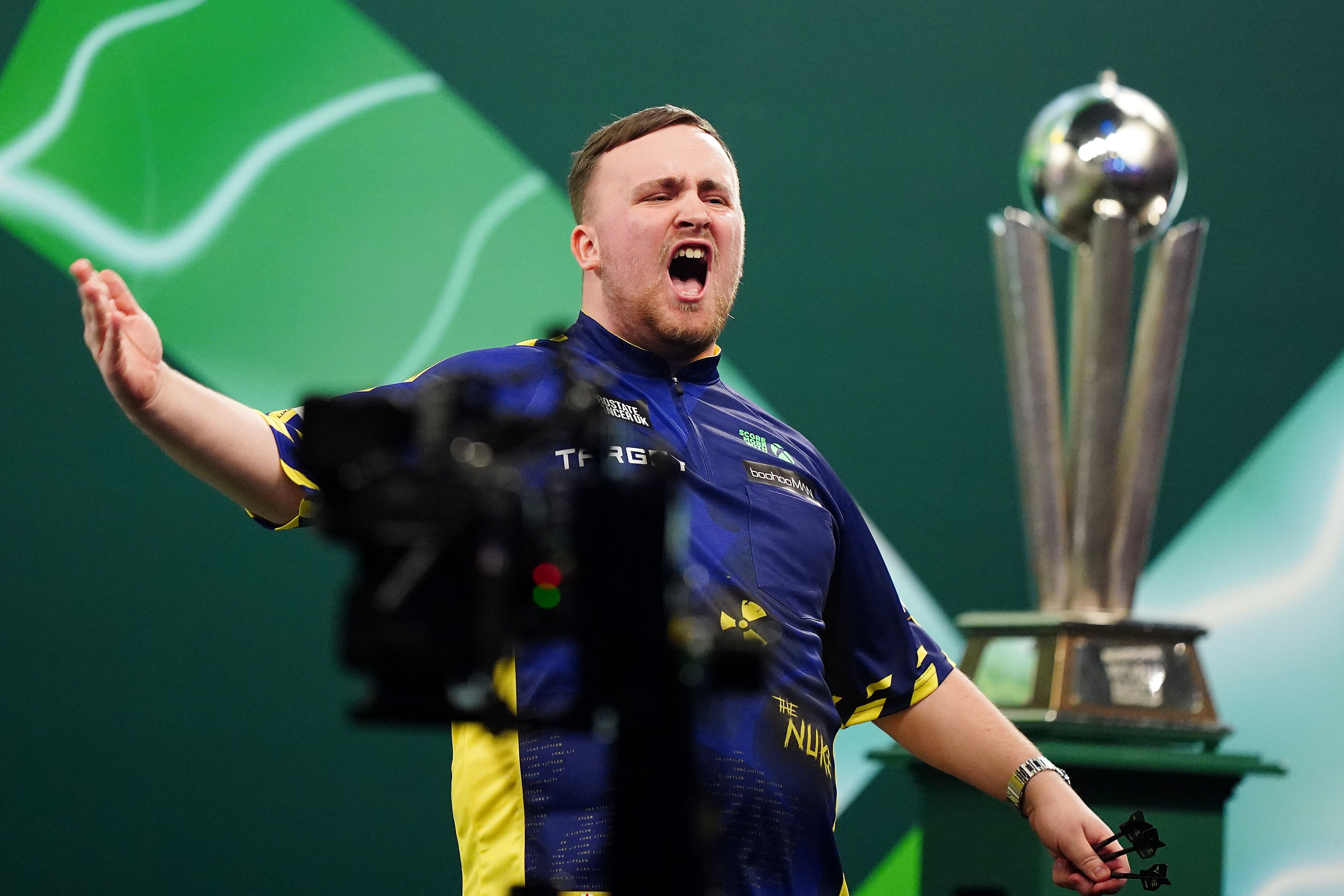 Littler reacts after clinching the World Darts Championship