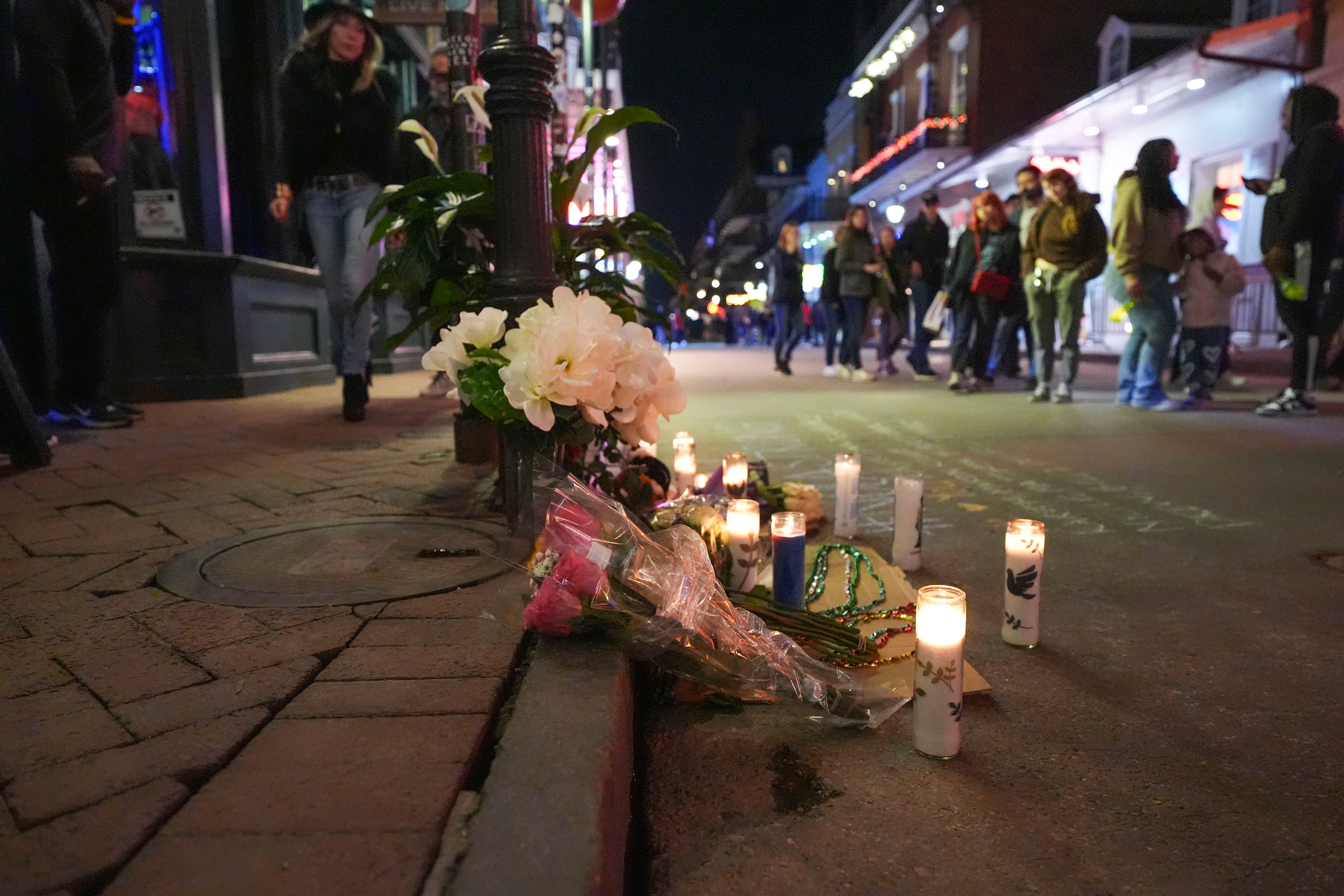 A memorial on Bourbon Street sits at the site of a deadly truck attack on New Year's Day. A planned lawsuit accused police of ‘negligence’ leading to the attack