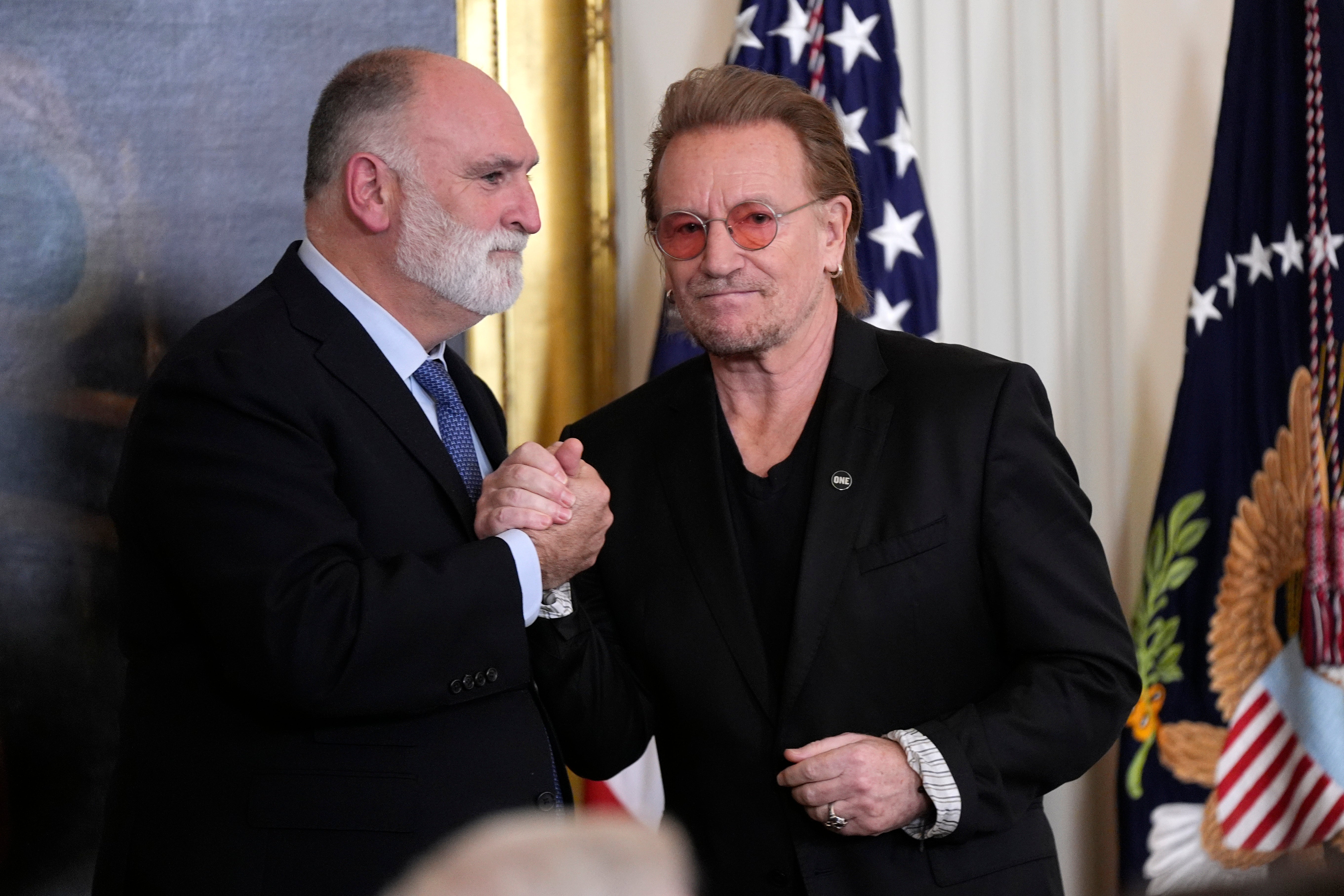 Chef Jose Andres, left, greets musician Bono before they received their honors