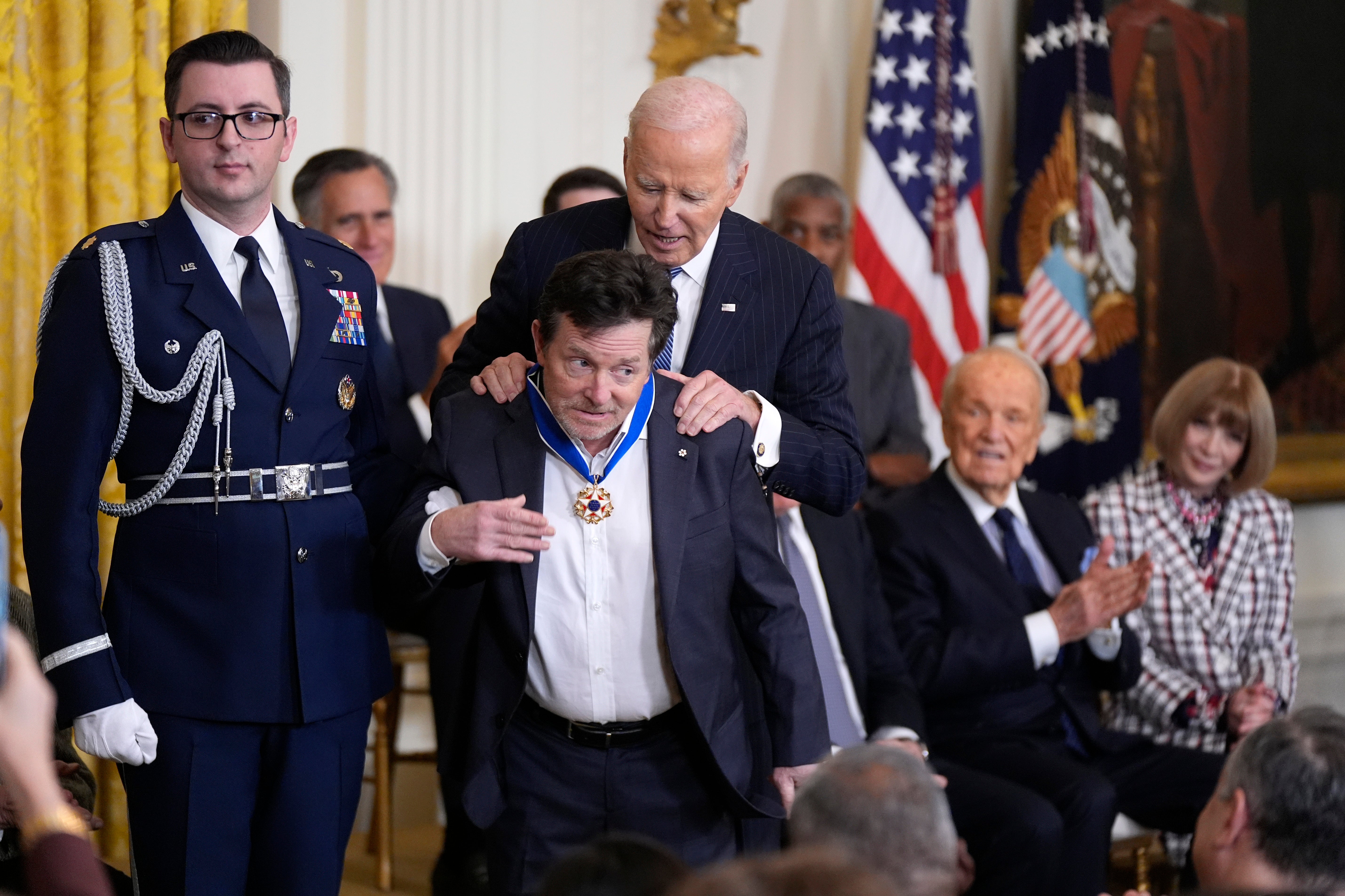 President Joe Biden presents the Presidential Medal of Freedom, the nation's highest civilian honor, to Michael J. Fox in the East Room of the White House