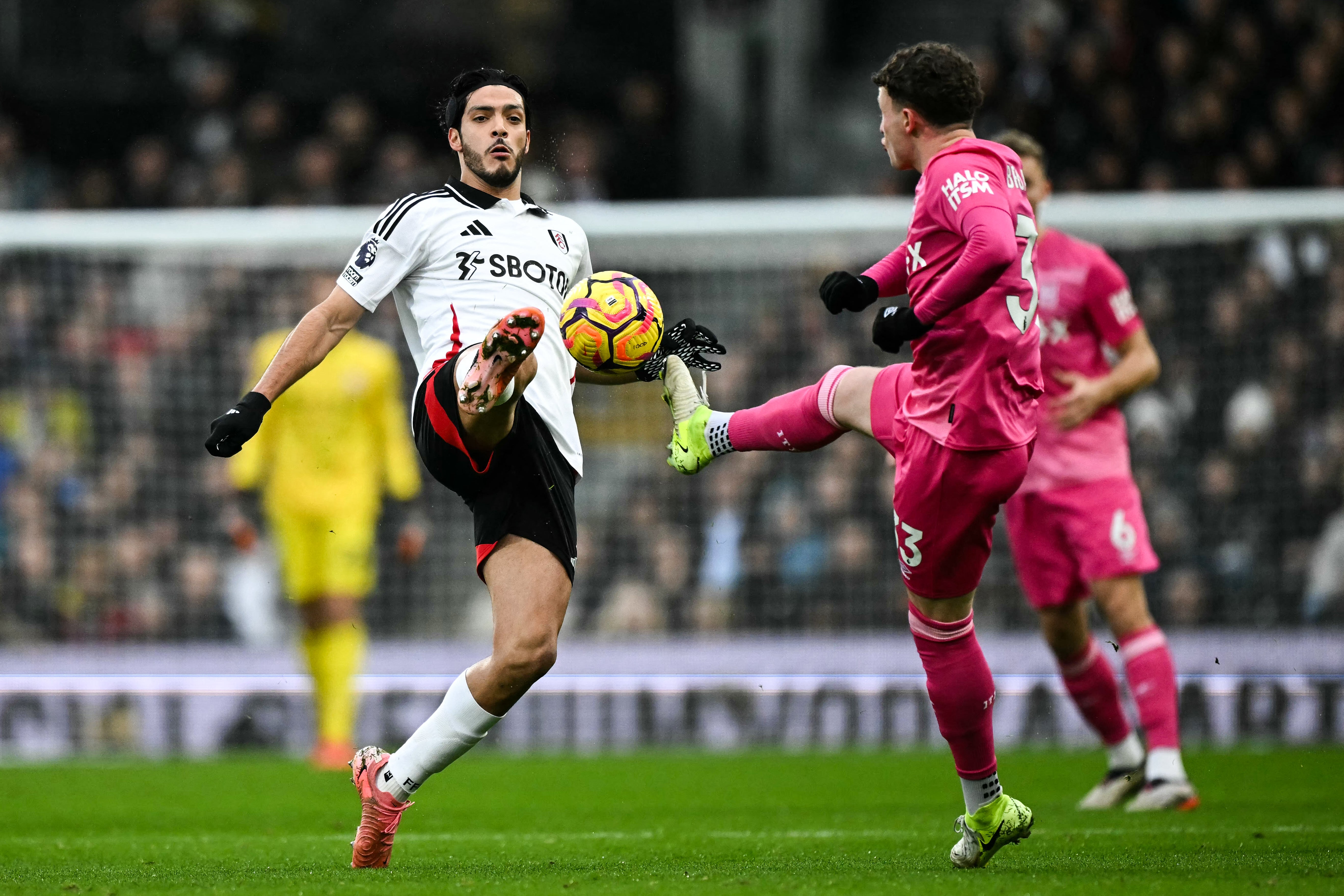 Fulham’s Raul Jimenez and Ipswich Town’s Nathan Broadhead battle for the ball