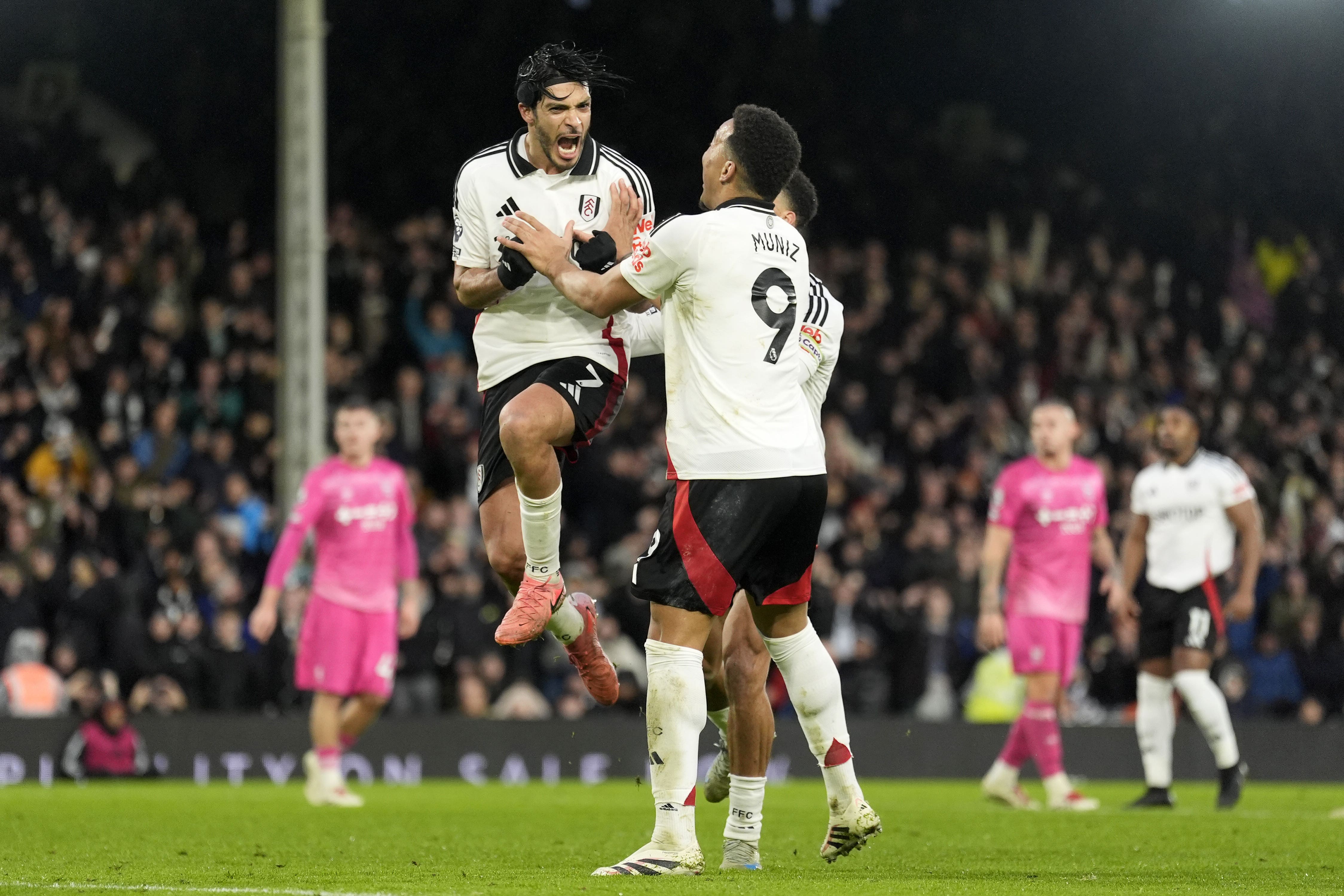 Raul Jimenez (left) snatched Fulham a point from the penalty spot