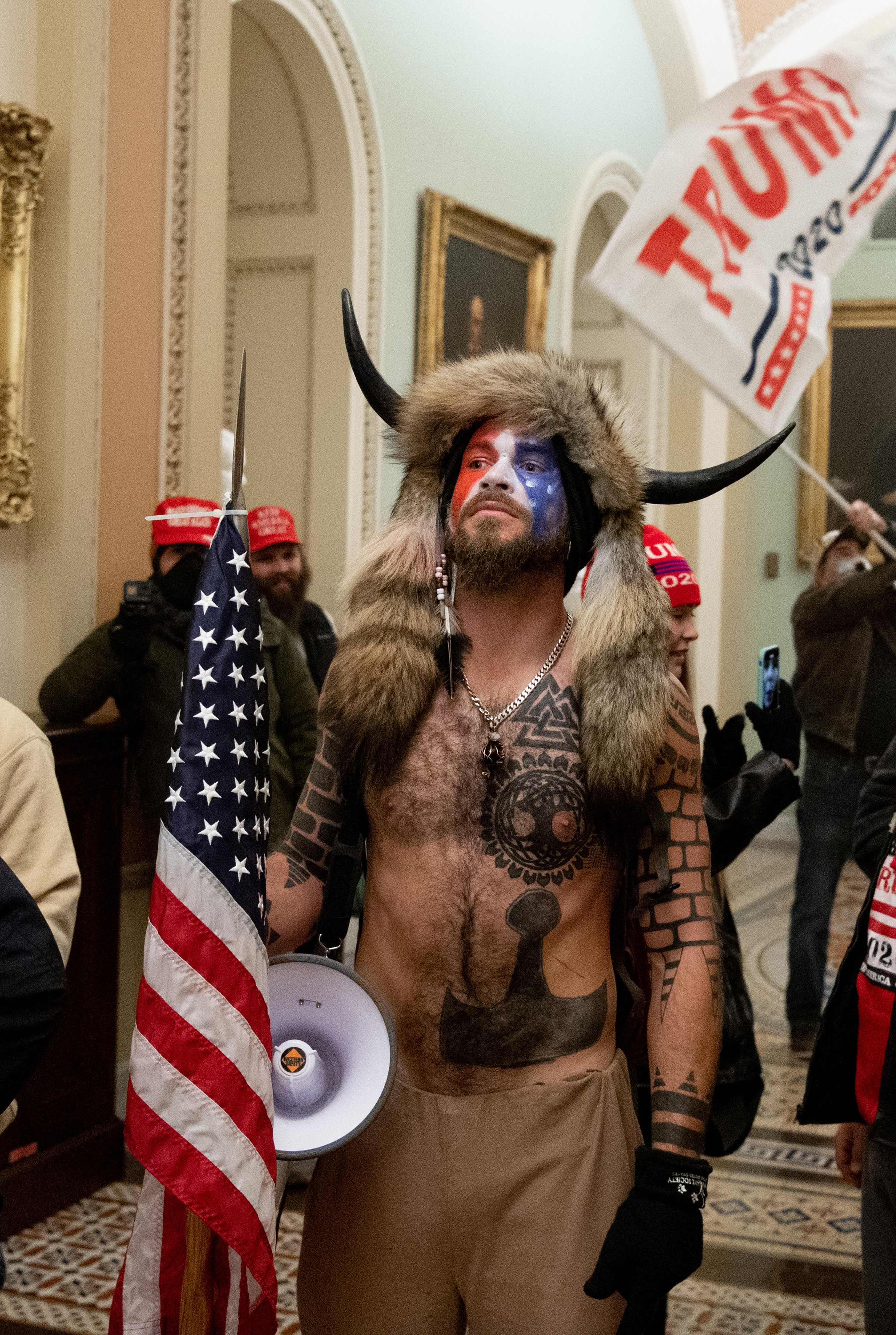 Jacob Chansley, dubbed the ‘QAnon Shaman’ for his role in “spearheading” the January 6 Capitol riot, has the symbol tattooed on his chest.