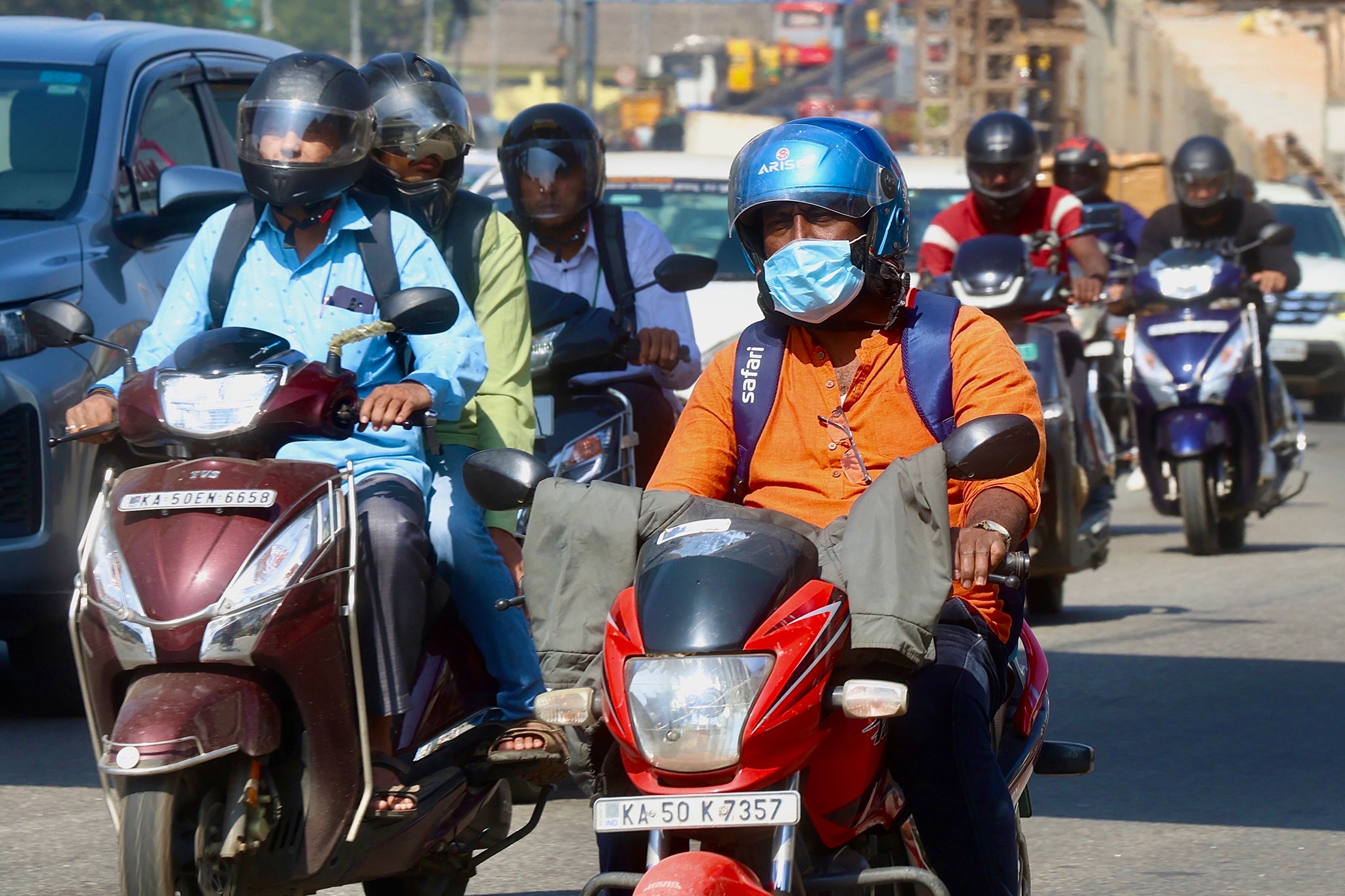 A motorcyclist pictured in Bangalore, India, where cases of HMPV have also been detected