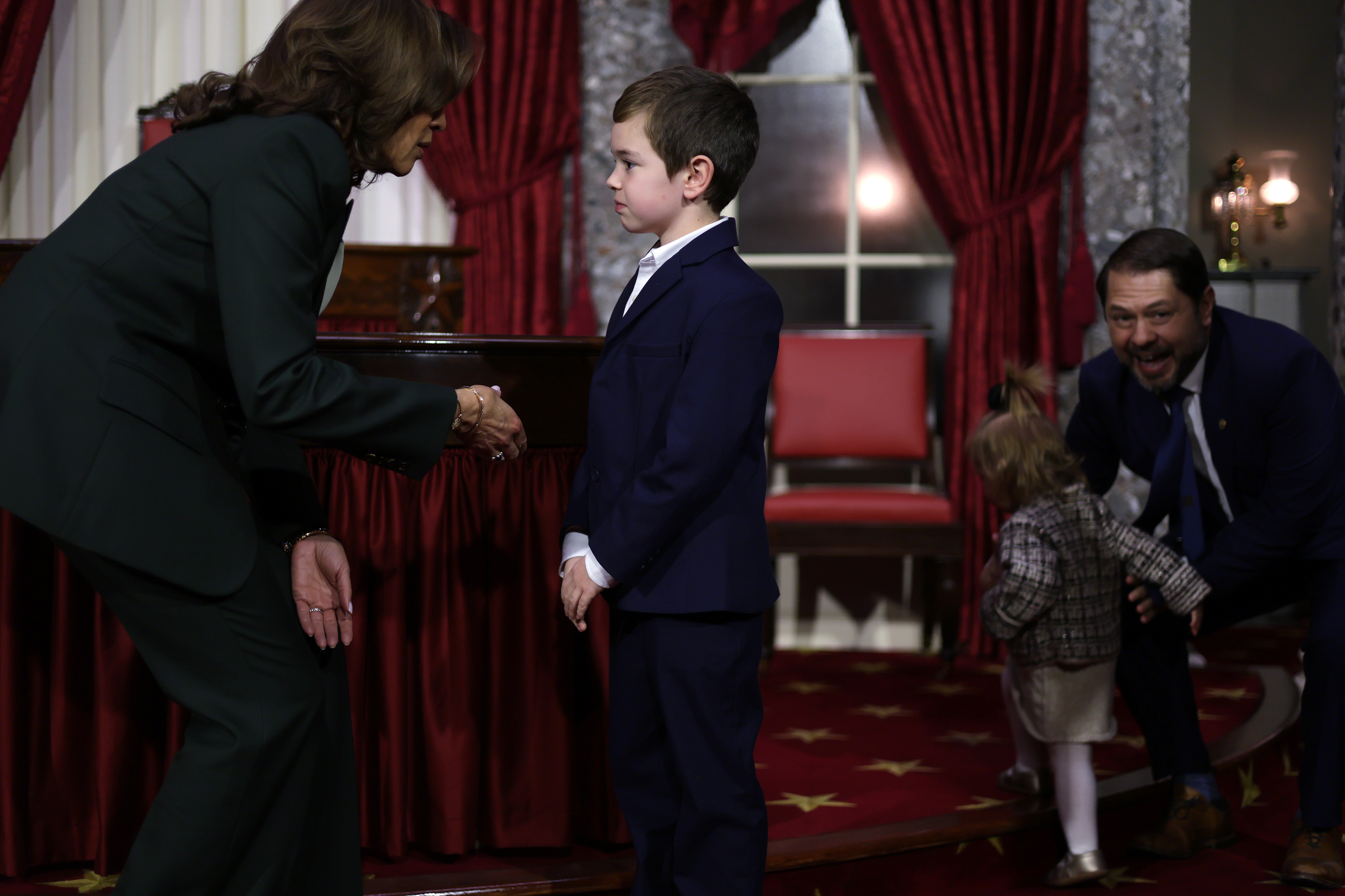 Vice President Kamala Harris reaches out to comfort Michael Gallego, son of Arizona Senator Ruben Gallego after he expressed his regret that Harris lost the presidential election during a ceremonial swearing-in at the U.S. Capitol last Friday.