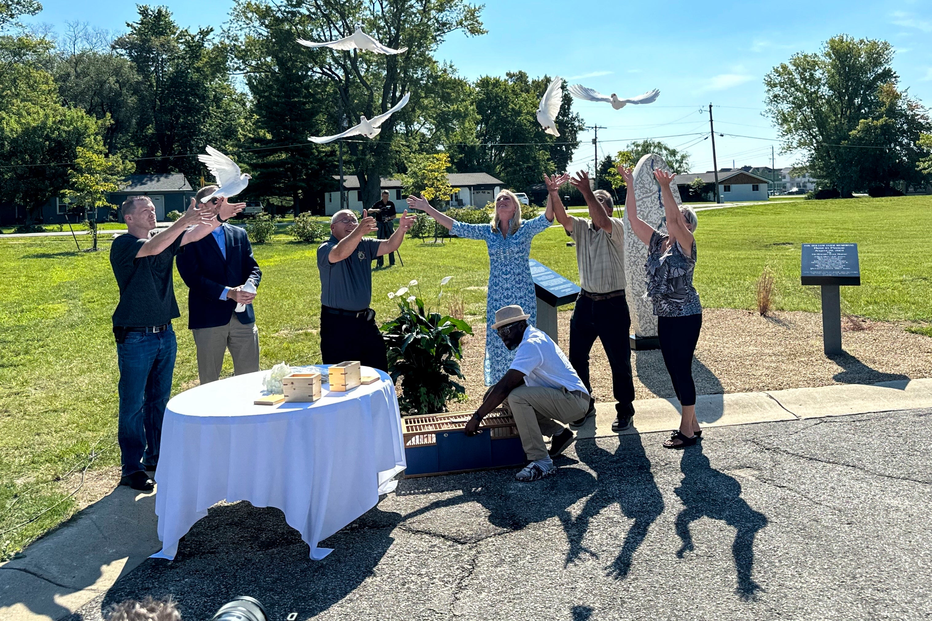 White doves are released on Aug. 29, 2024, in Westfield, Indiana, during the dedication of a memorial to the nine