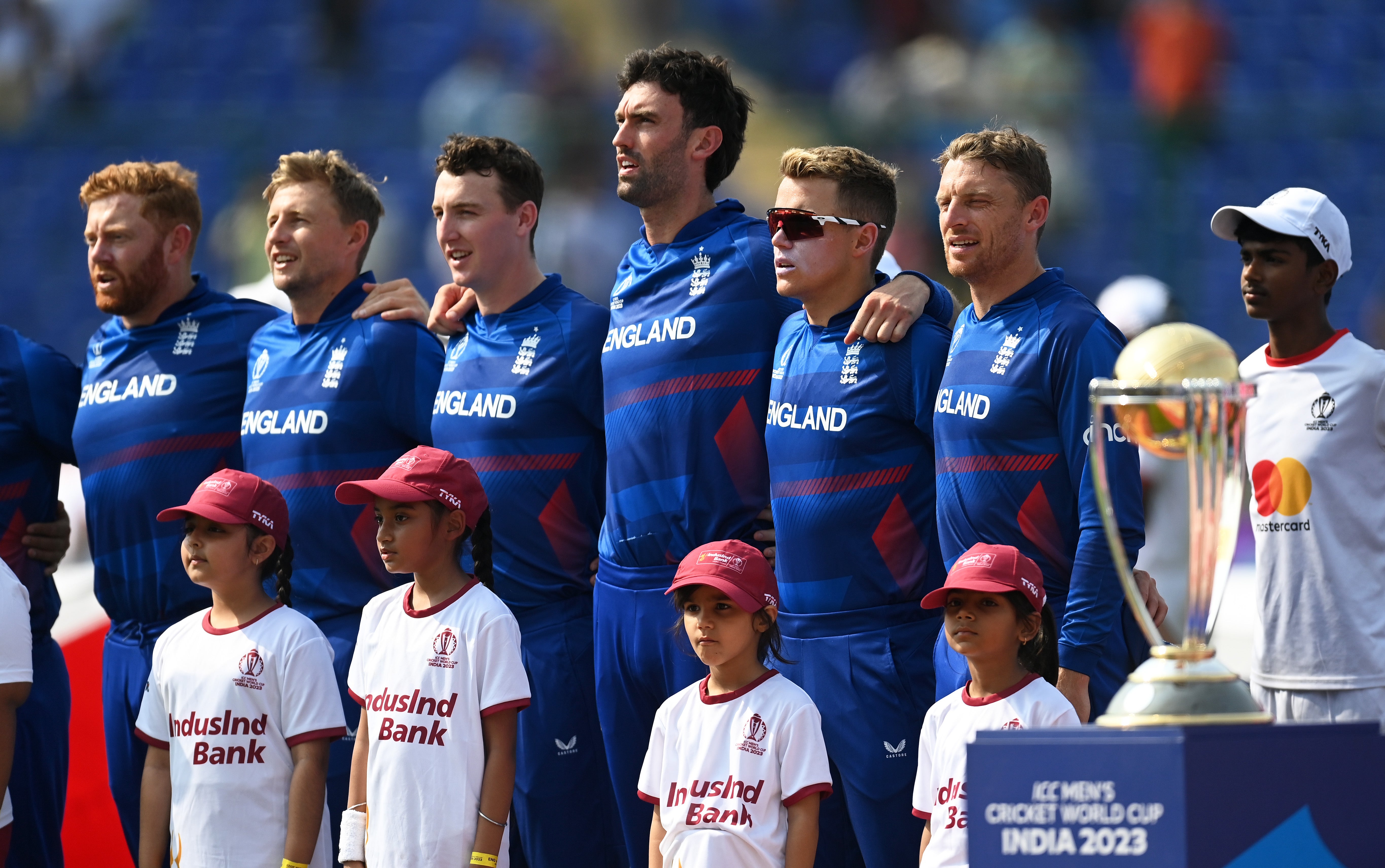 Jonny Bairstow, Joe Root, Harry Brook, Reece Topley, Sam Curran and Jos Buttler line up for the National Anthems ahead of the ICC Men’s Cricket World Cup India in 2023