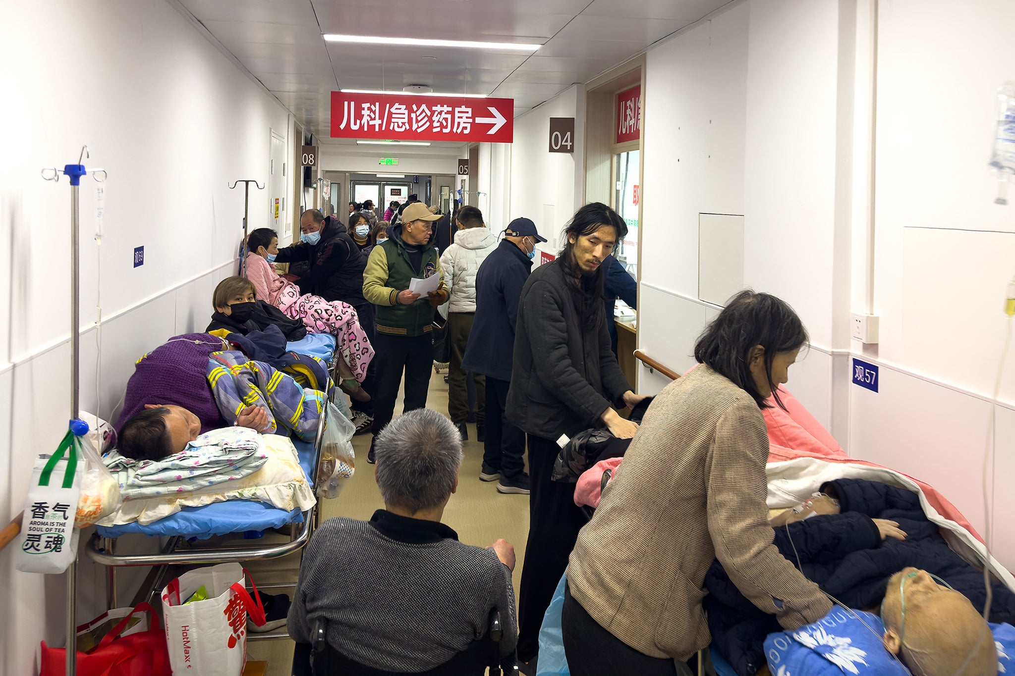 Patients wait at a pediatric and emergency area of a hospital amid a spike in respiratory illnesses in China