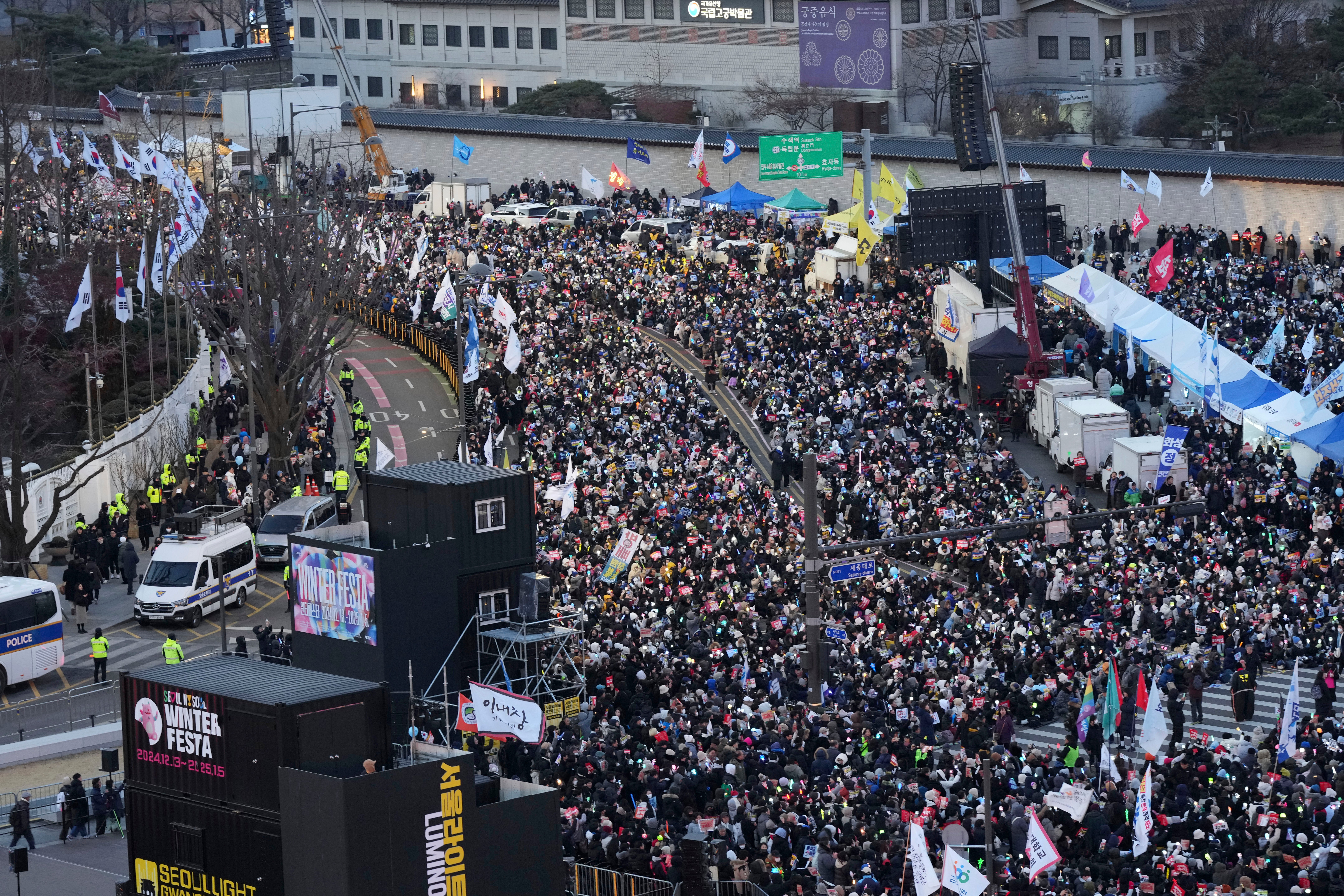 Protesters gather during a rally demanding South Korea's impeached President Yoon Suk Yeol to resign, in downtown Seoul, South Korea, on 28 December