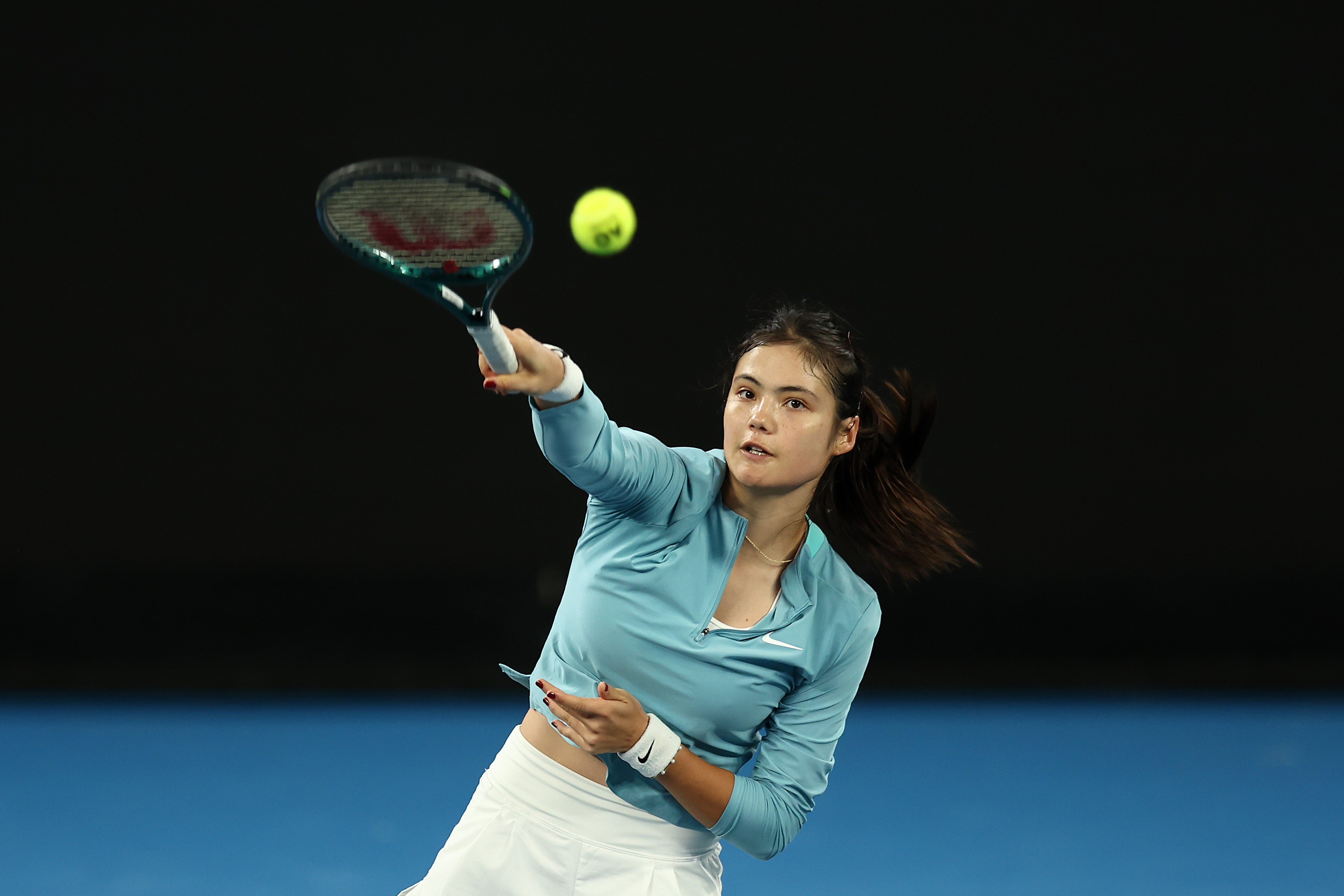 Emma Raducanu serves during a practice session ahead of the 2025 Australian Open at Melbourne Park