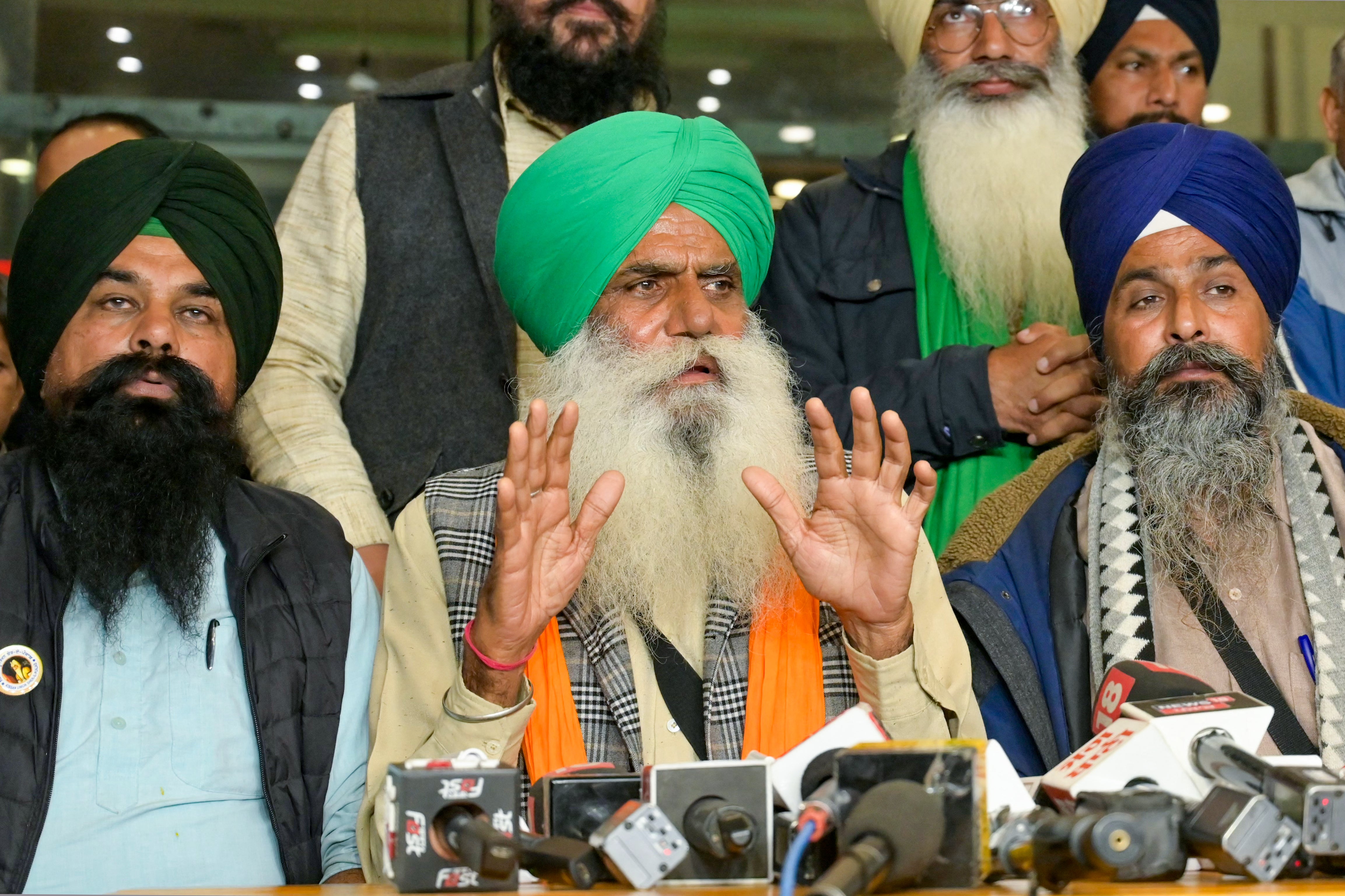 Jagjit Singh Dallewal, centre, addresses a press conference in February 2024