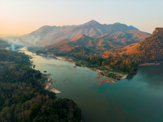 <p>A large stretch of the Thailand-Laos border follows the Mekong River, so a boat is the perfect way to cross it </p>