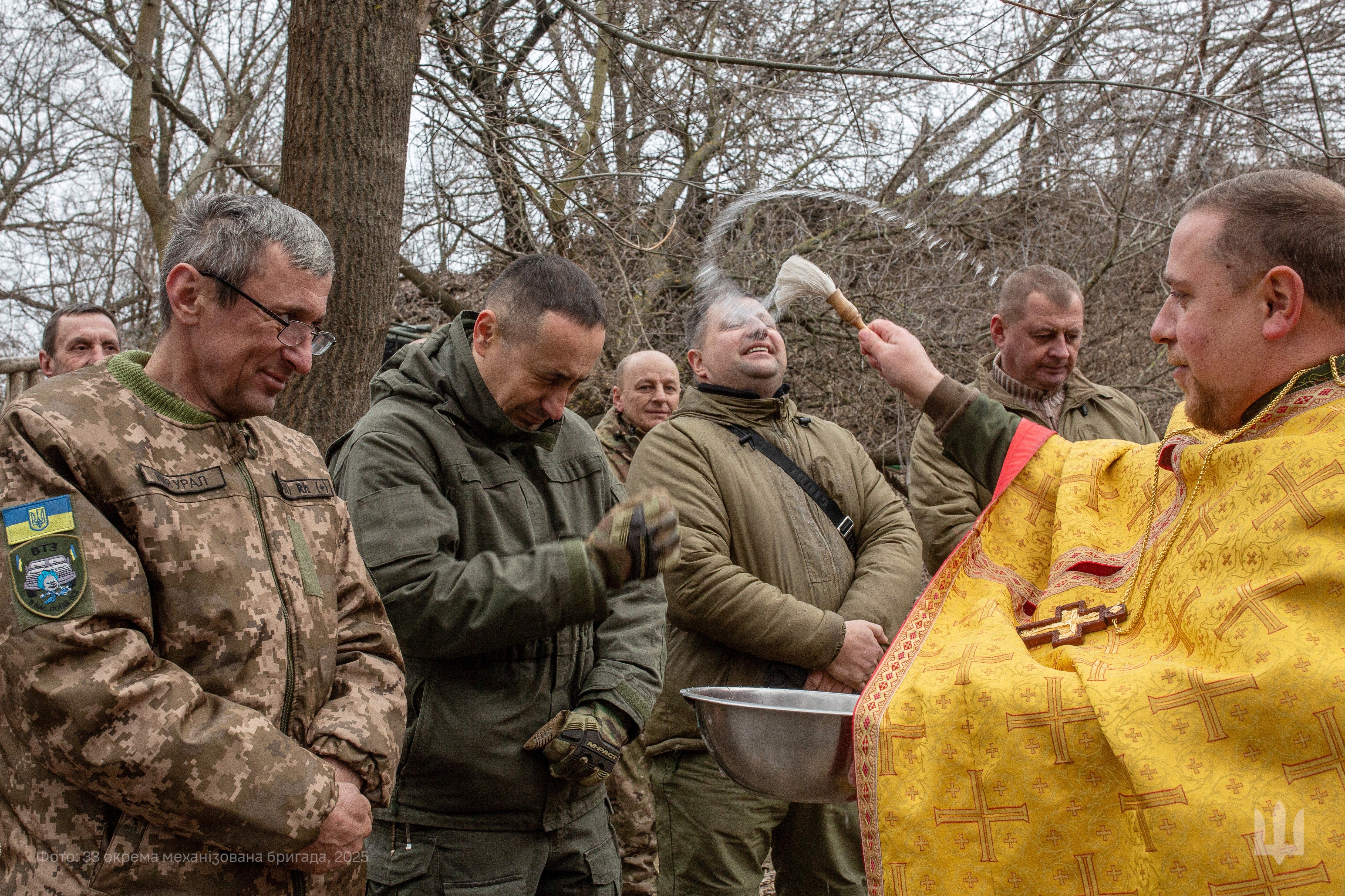 A chaplain of the 33rd separate mechanised brigade conducts a holiday service to celebrate Epiphany in an undisclosed location in the Dnipropetrovsk region of Ukraine