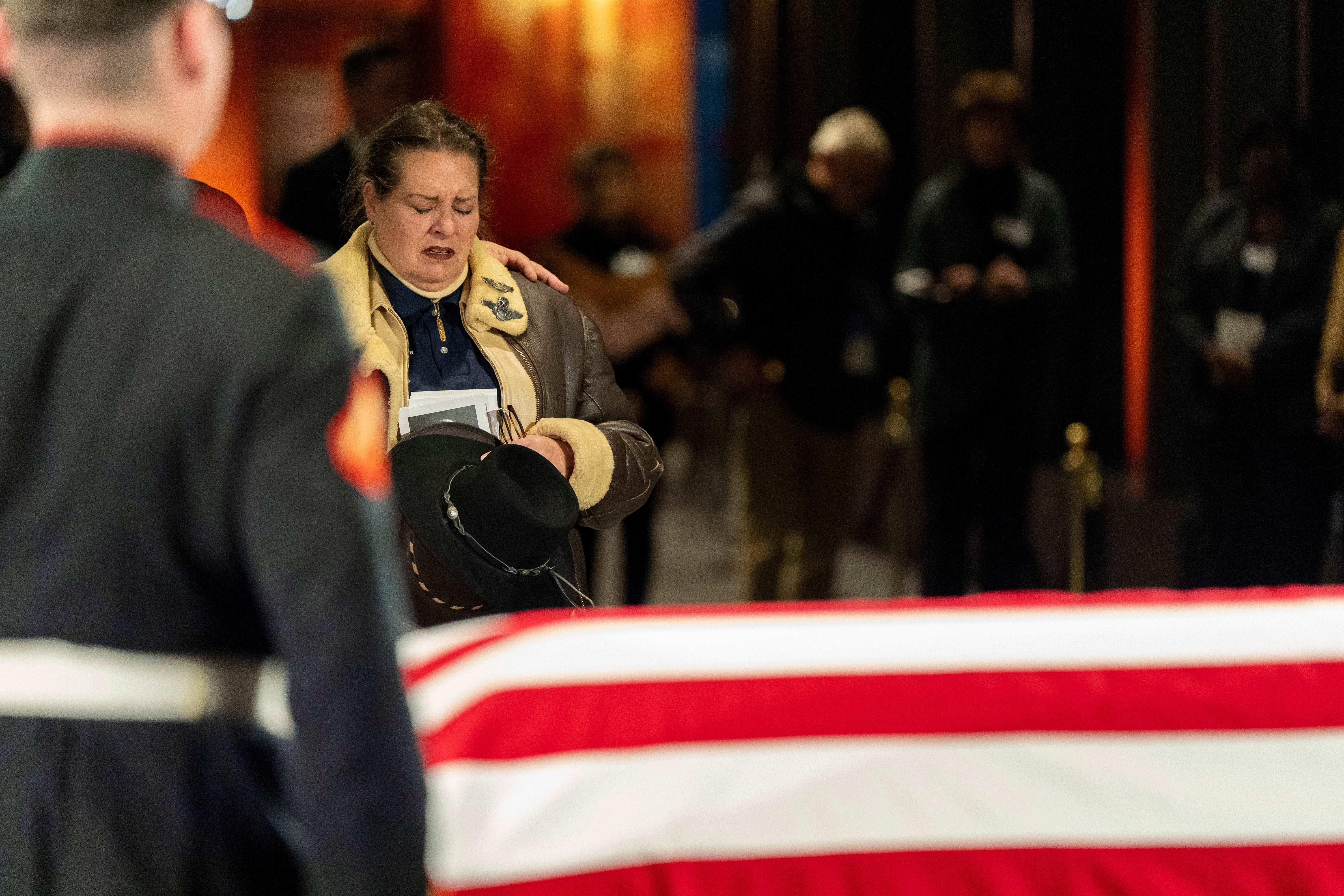 Mourners view the casket of former President Jimmy Carter as he lies in repose at the Jimmy Carter Presidential Library and Museum on January 7, 2025 in Atlanta, Georgia