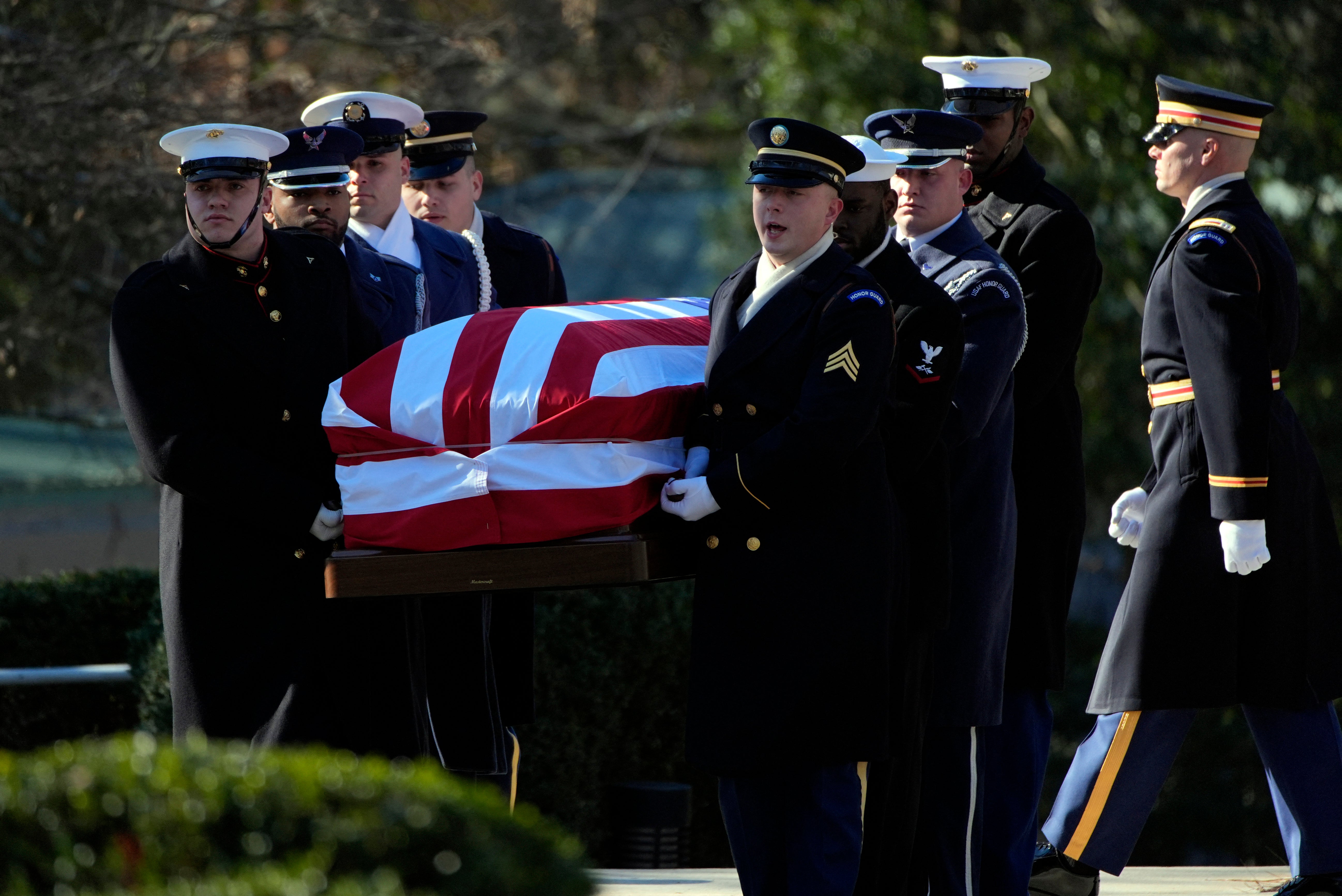 The casket of former President Jimmy Carter is carried by a joint services body bearer team from the Jimmy Carter Presidential Library and Museum in Atlanta, Georgia on January 7, 2025