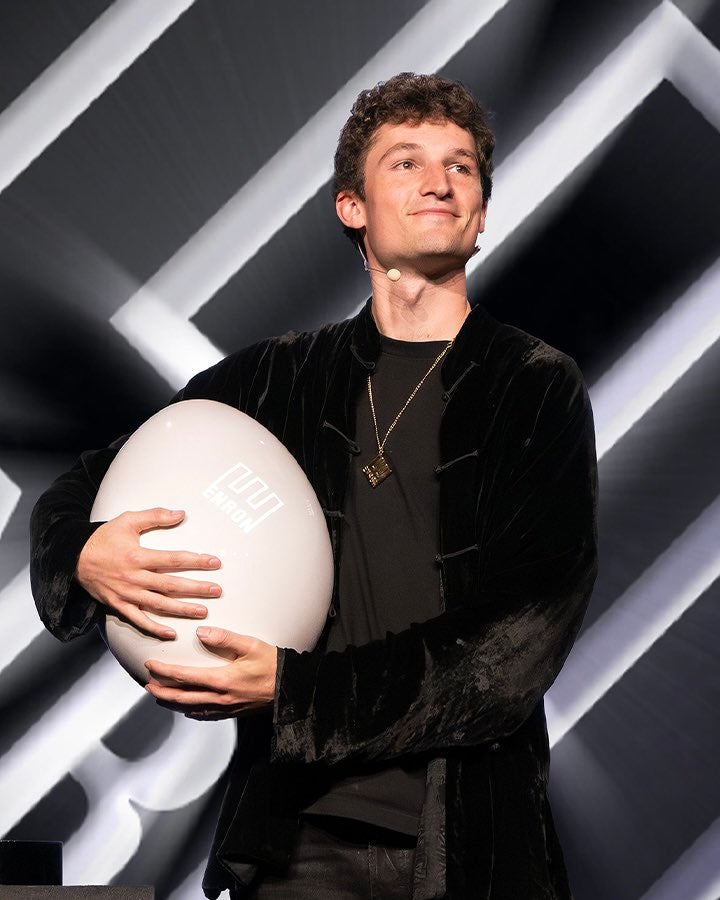 Enron CEO Connor Gaydos poses for a photo holding the Enron Egg. The Egg, a ‘micro-nuclear reactor,’ is a parody, but the launch had social media users questioning its legitimacy