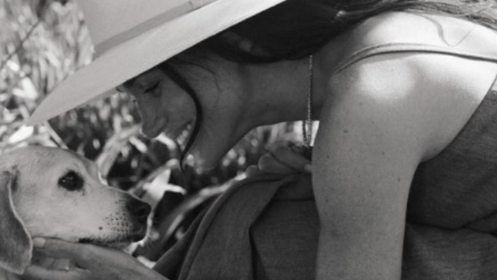 Meghan with her late beagle Guy