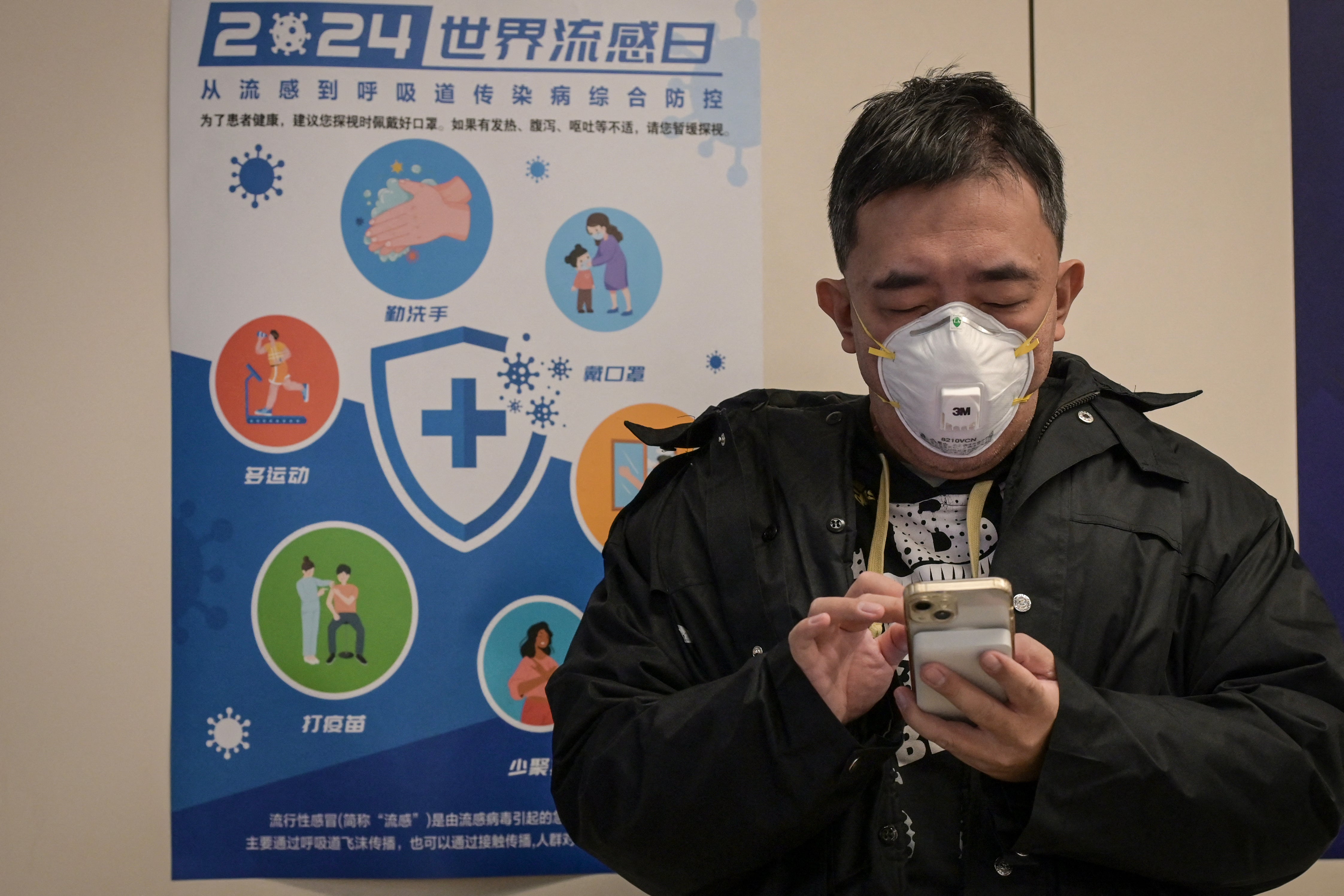 A patient waits in a hospital ward amid an outbreak of HMPV across China