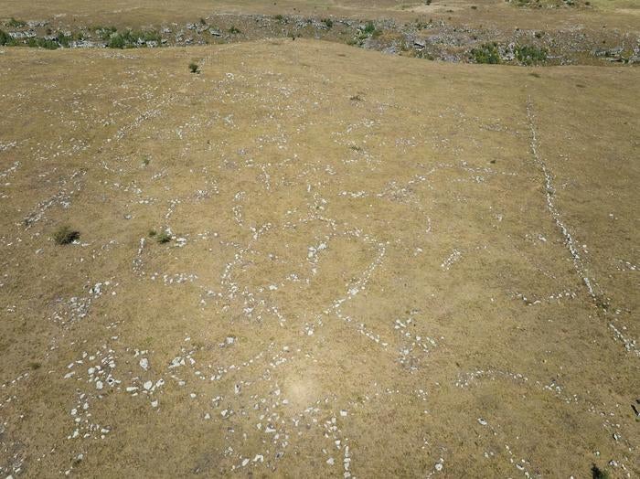 Structures in the outer settlement with 1km long fortification wall visible in upper left