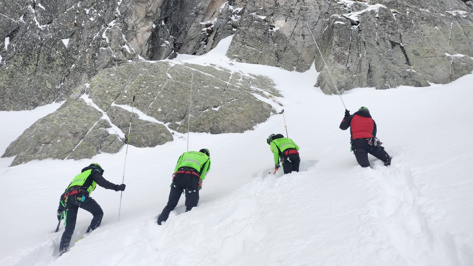 Italian rescue workers search an area in the Dolomites