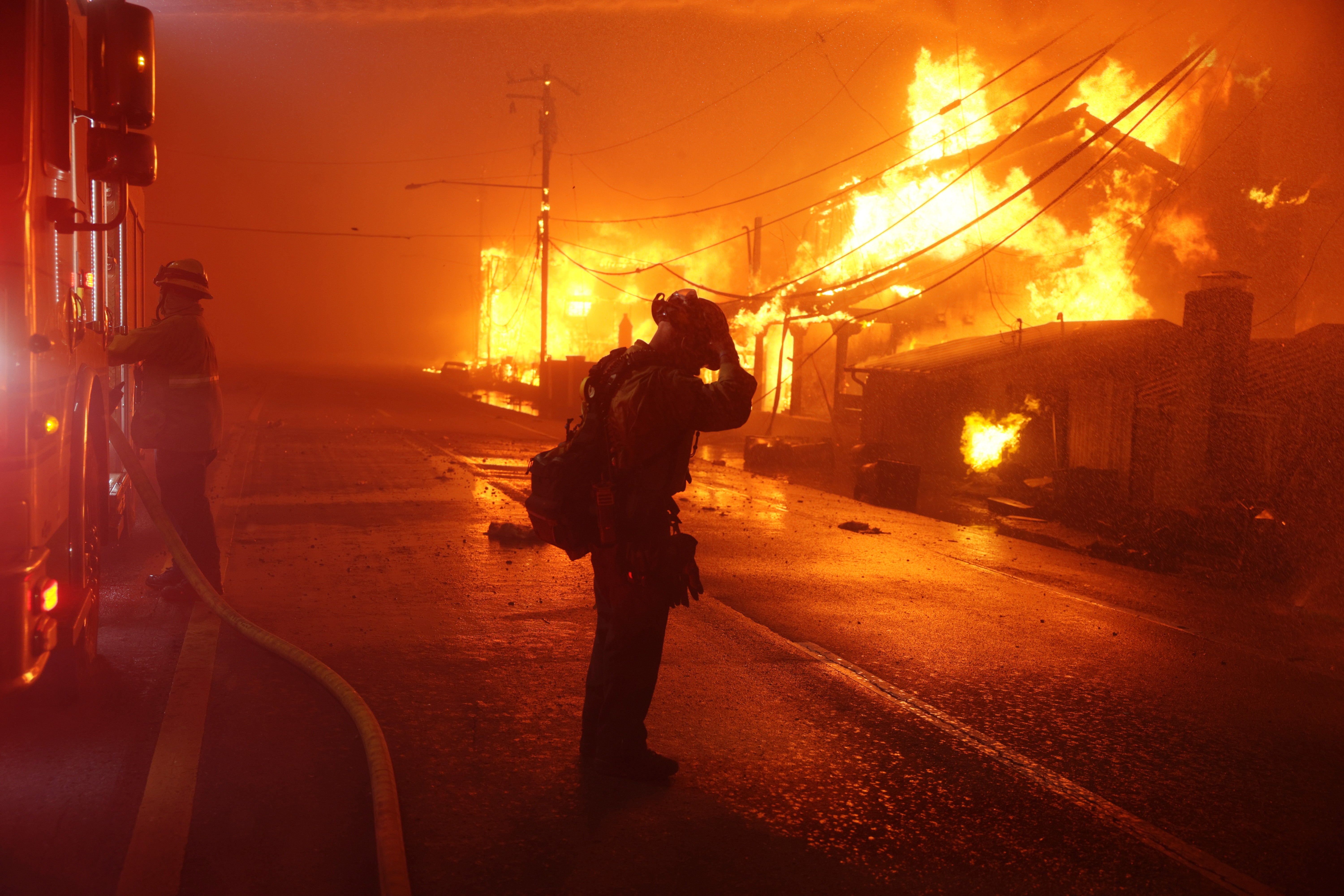 A firefighter reacts as the Palisades wildfire burns multiple structures along the Pacific Coast Highway in Malibu. Although thousands of emergency responders have been trying to put out the blazes, they are 0 percent contained as the windstorm fuels the fires, leading to more destruction. Actor Steve Guttenberg was spotted assisting fire crews near his home by clearing cars from the streets to give emergency vehicles access. He told Entertainment Weekly : “In a crisis, always remember that you are, you’re part of a community.” He continued: “And if you’re able-bodied, you’ve got to help. You’ve got to help. You can’t walk by somebody when they need something. You just can’t walk by them. You have to help them.”