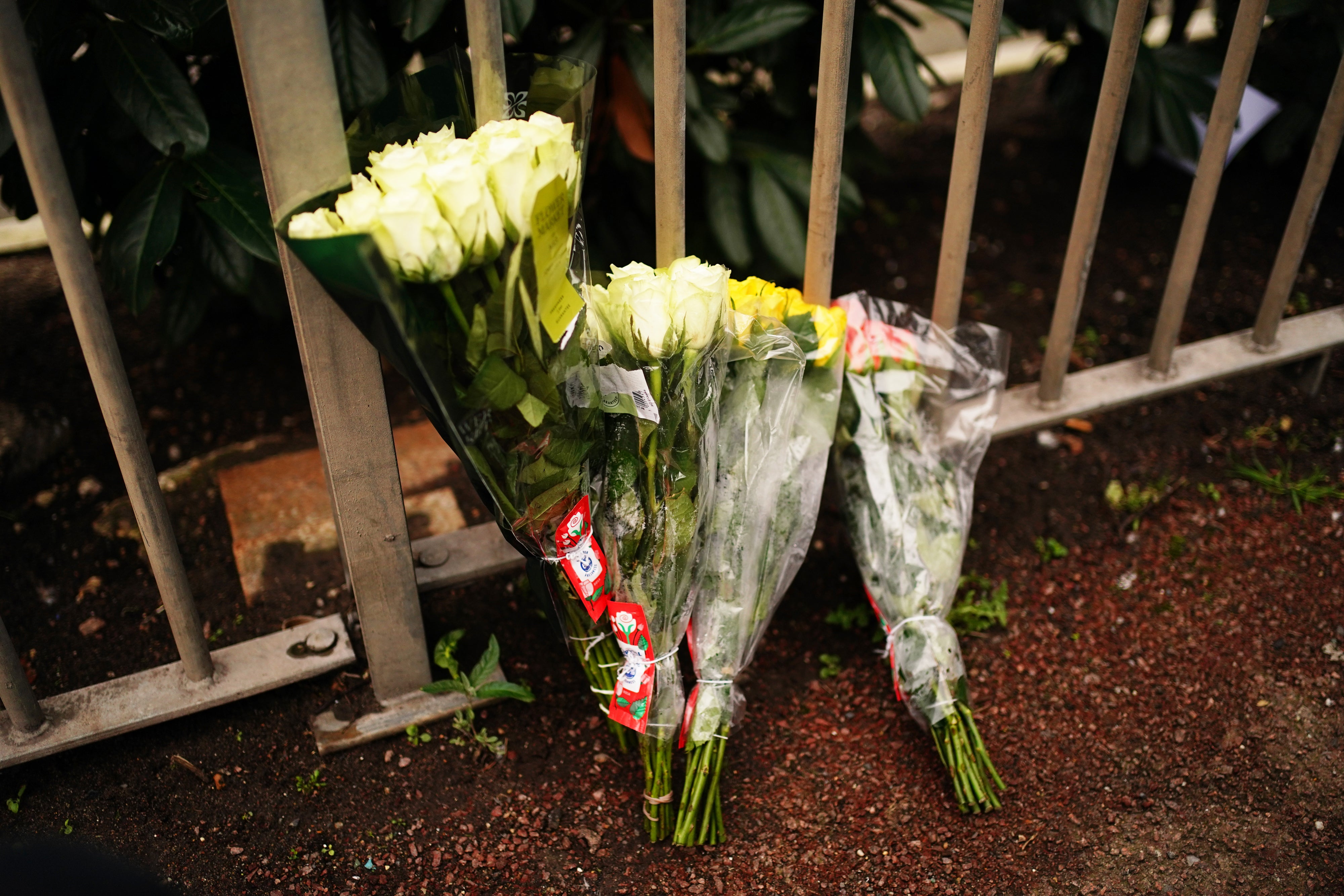 Flowers left in tribute at a bus stop in southeast London