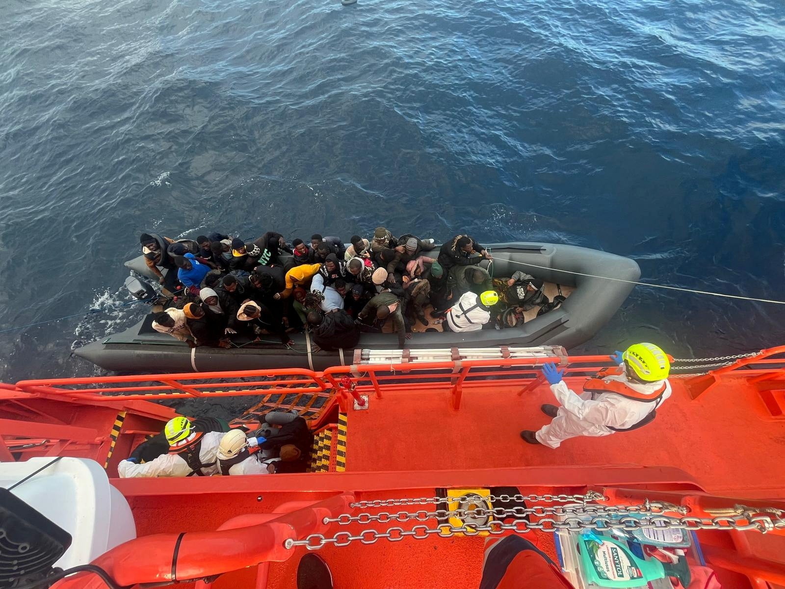 The rubber boat contained 60 people, including 14 women and four children.