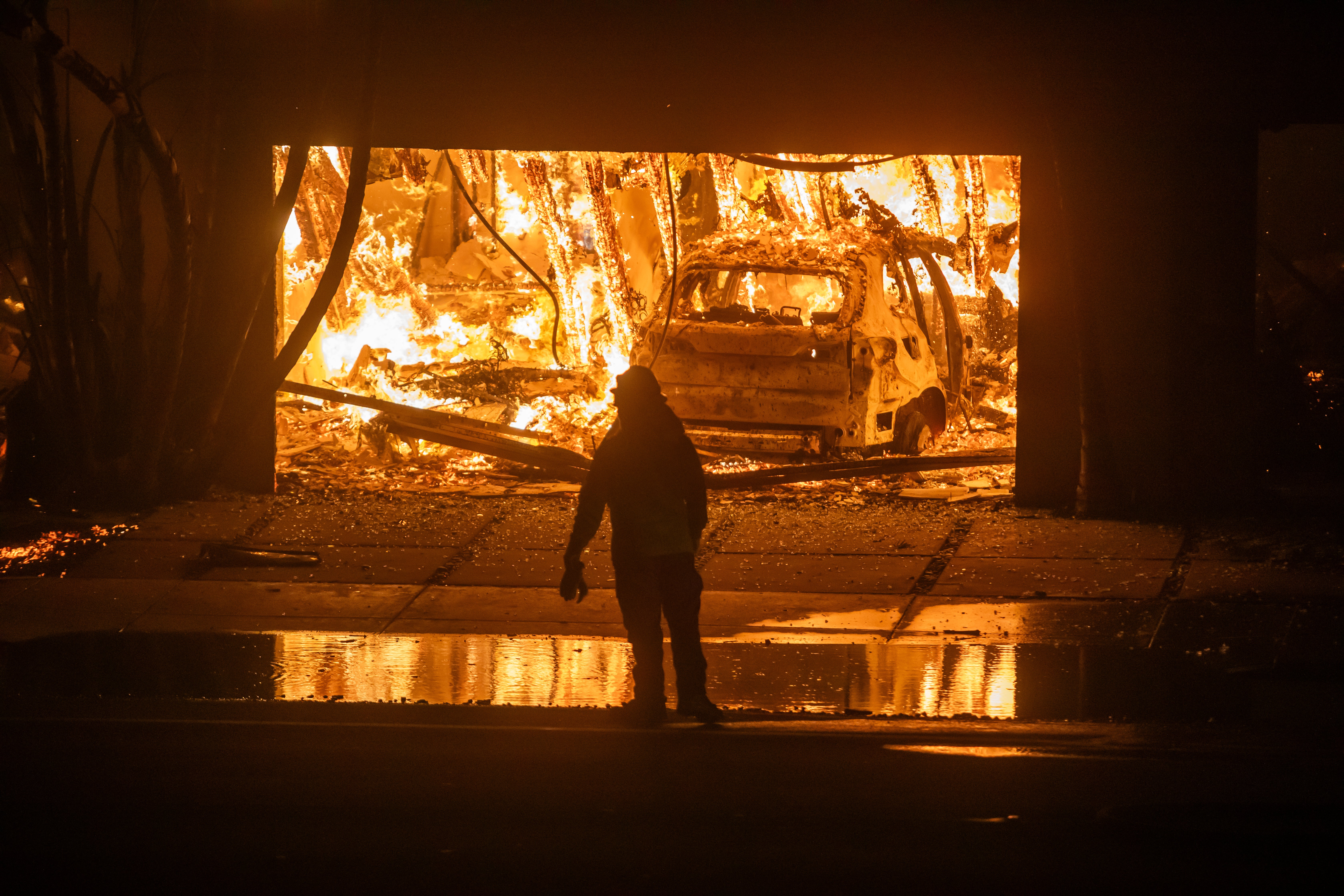 At least two deaths have been reported in the fires that continue to spread across Southern California