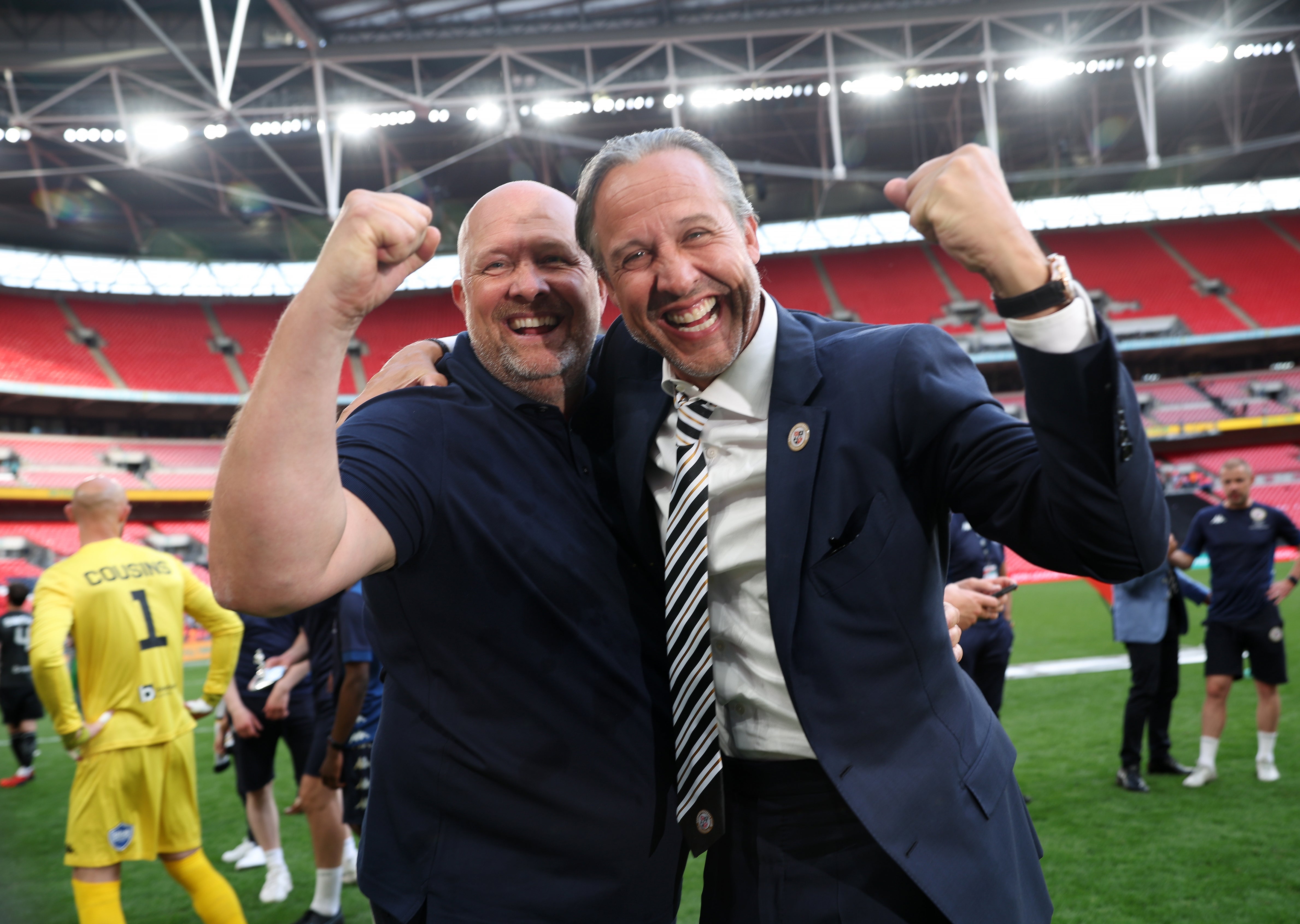 Bromley manager Andy Woodman, left, and owner Robin Stanton-Gleaves celebrate promotion to League Two