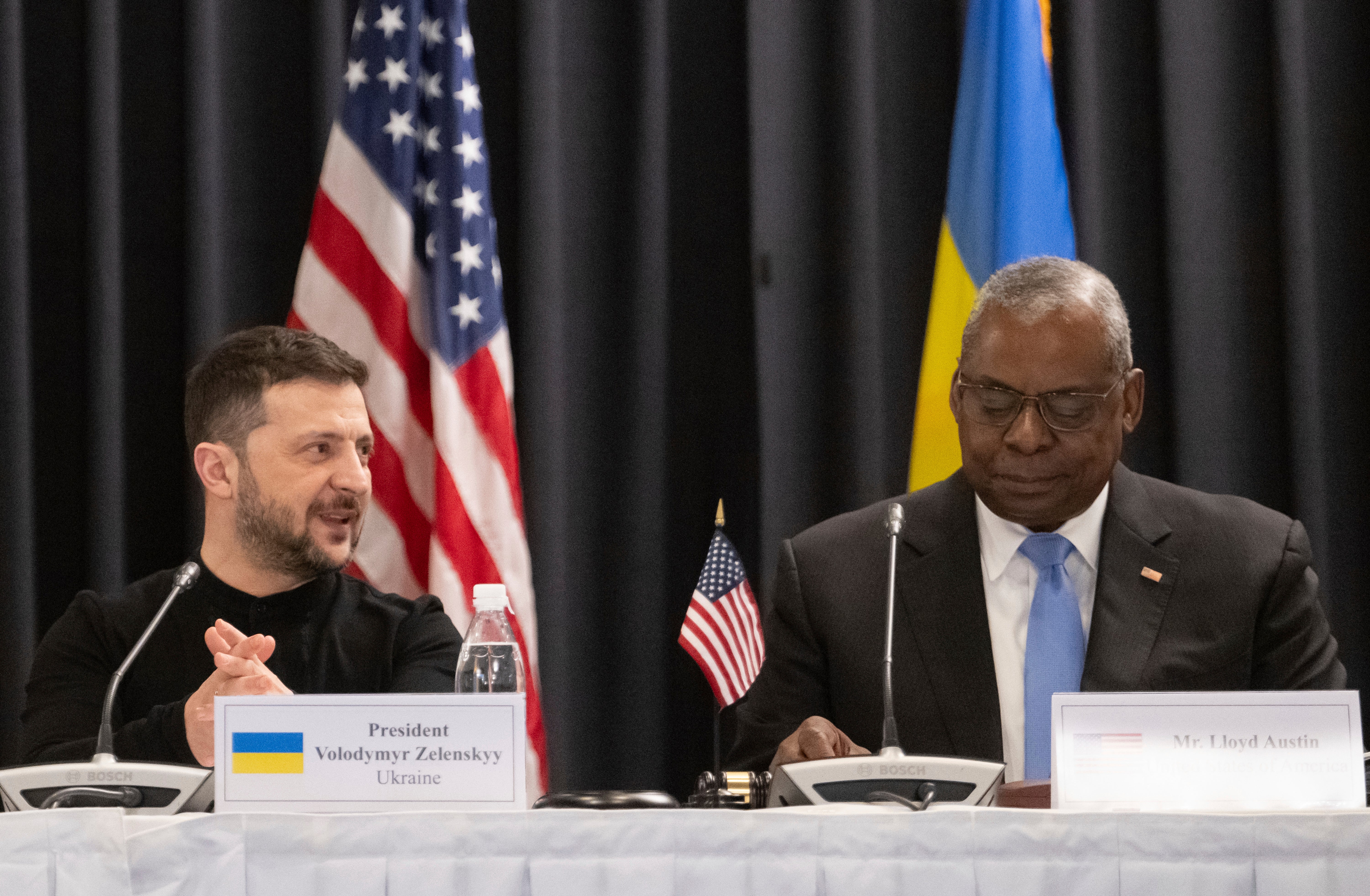 Ukrainian president Volodymyr Zelensky sits next to US defence secretary Lloyd Austin III at the Ramstein air base, Germany