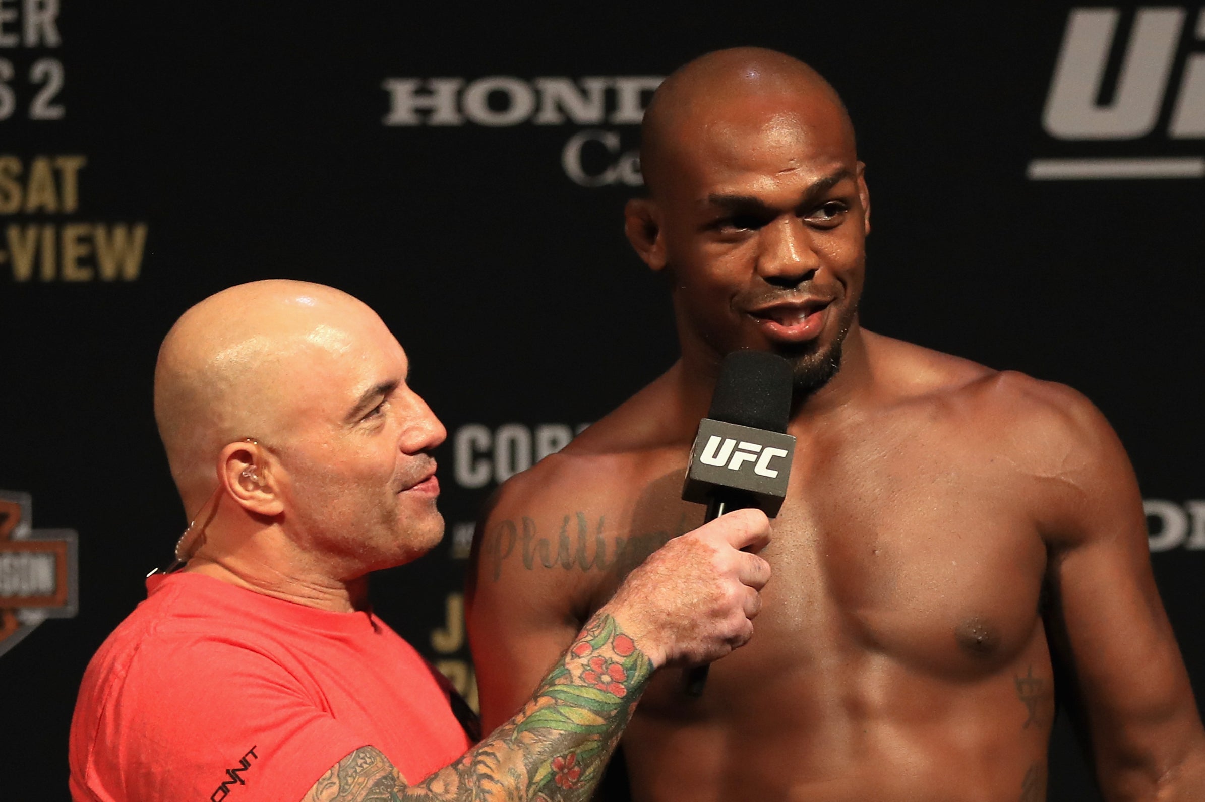 UFC commentator Joe Rogan, now chiefly a podcaster, with Jon Jones (right) in 2017