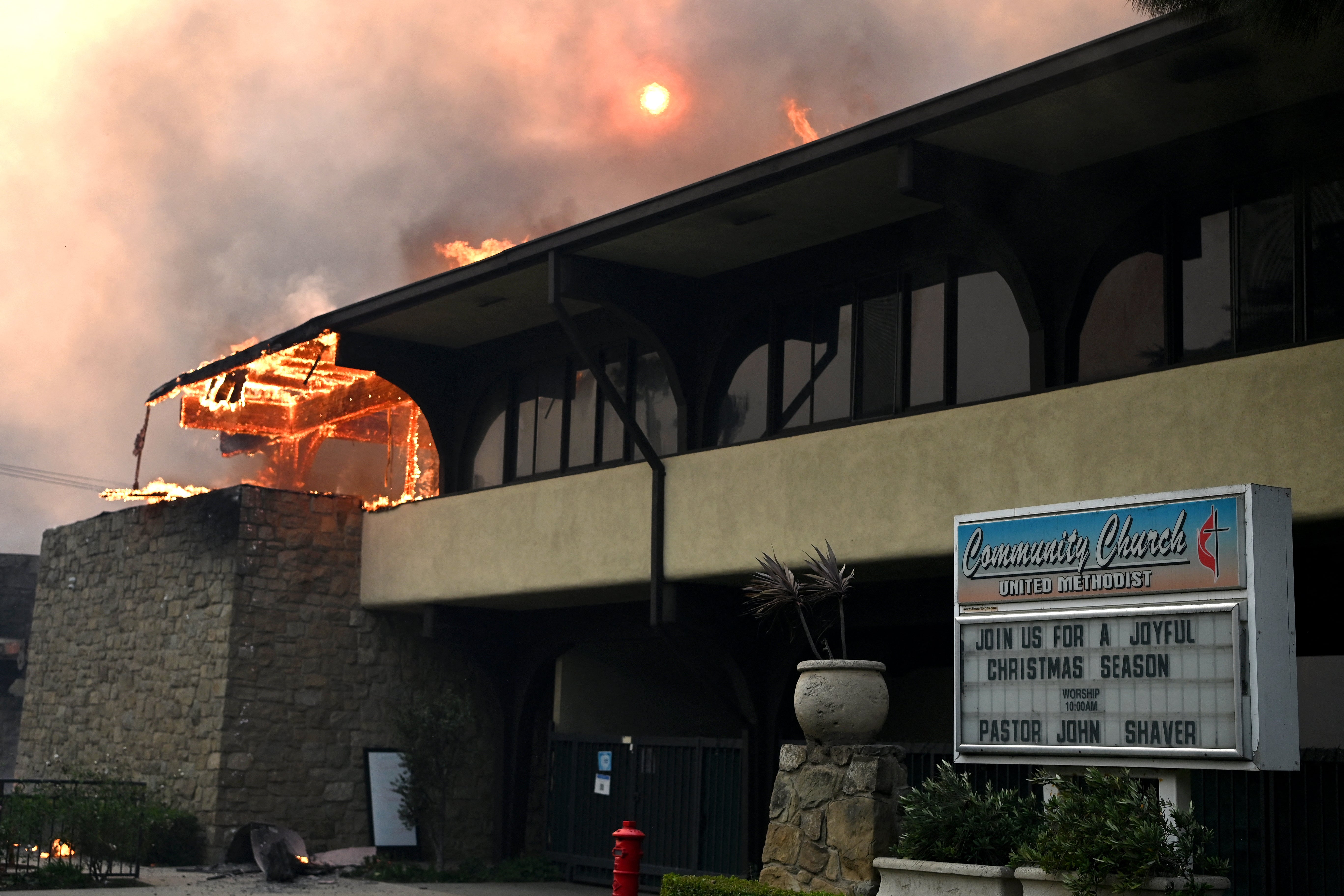 A Pacific Palisades church that went up in flames amid a wildfire expected to cost $10 billion in losses