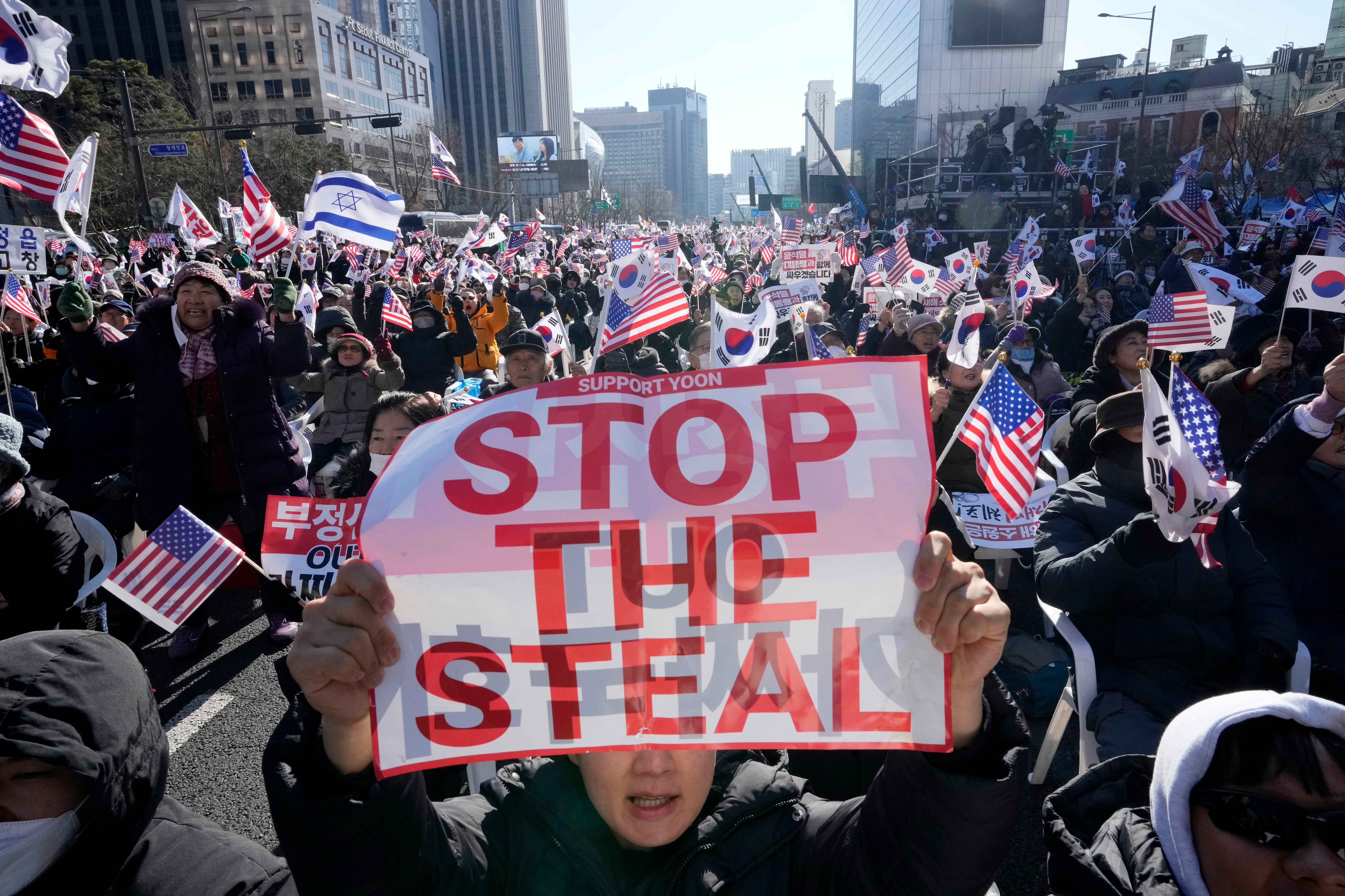 Supporters of impeached South Korean President Yoon Suk Yeol stage a rally against his impeachment in Seoul, South Korea