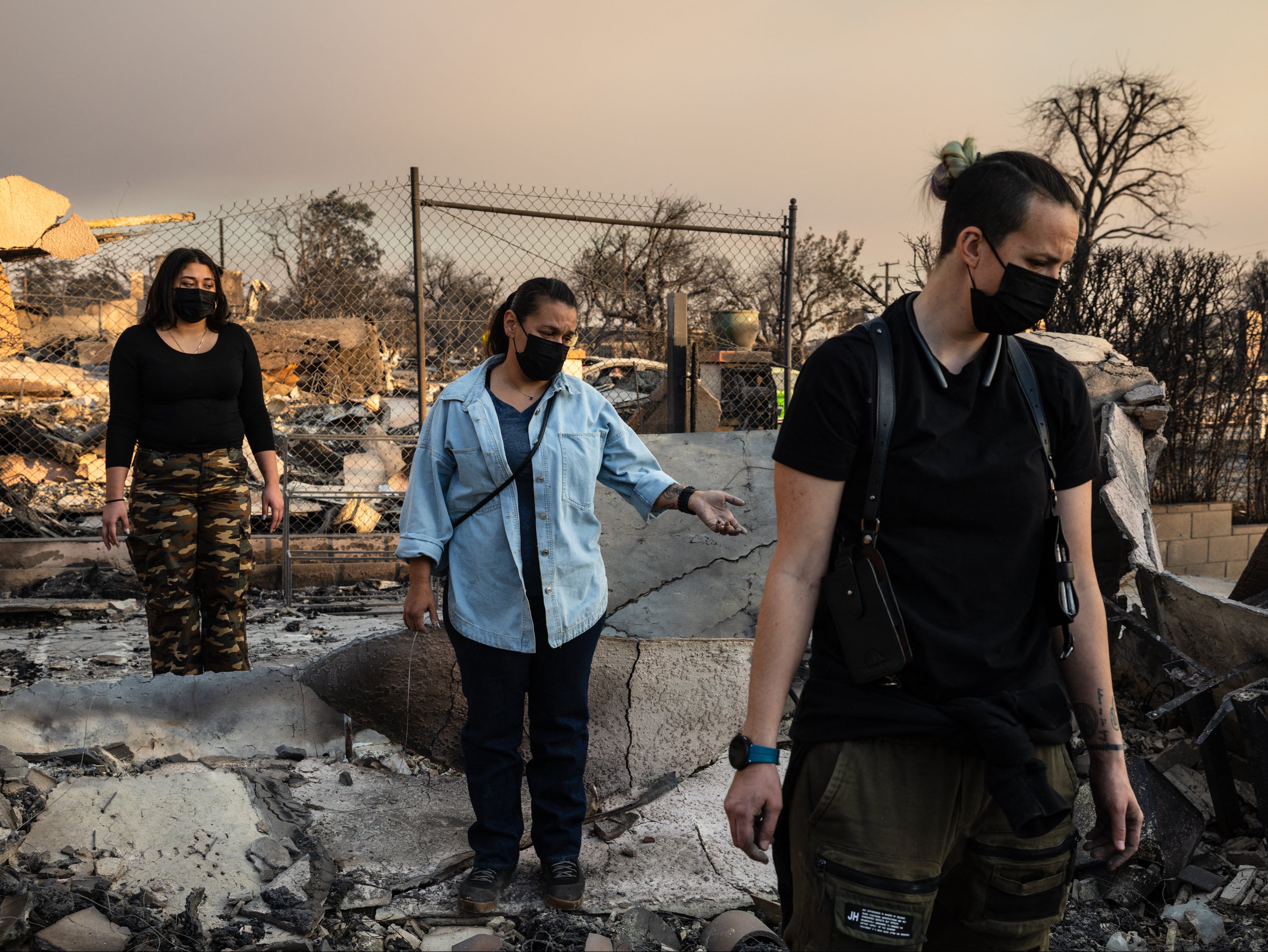 Distraught residents survey the charred ruins of their homes burned in the Eaton Fire in Altadena, California, on January 9 2025