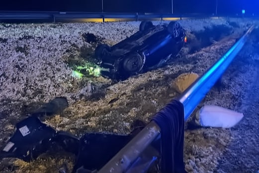 The overturned BMW vehicle that was carrying the family-of-six before the crash in the early hours of Thursday morning