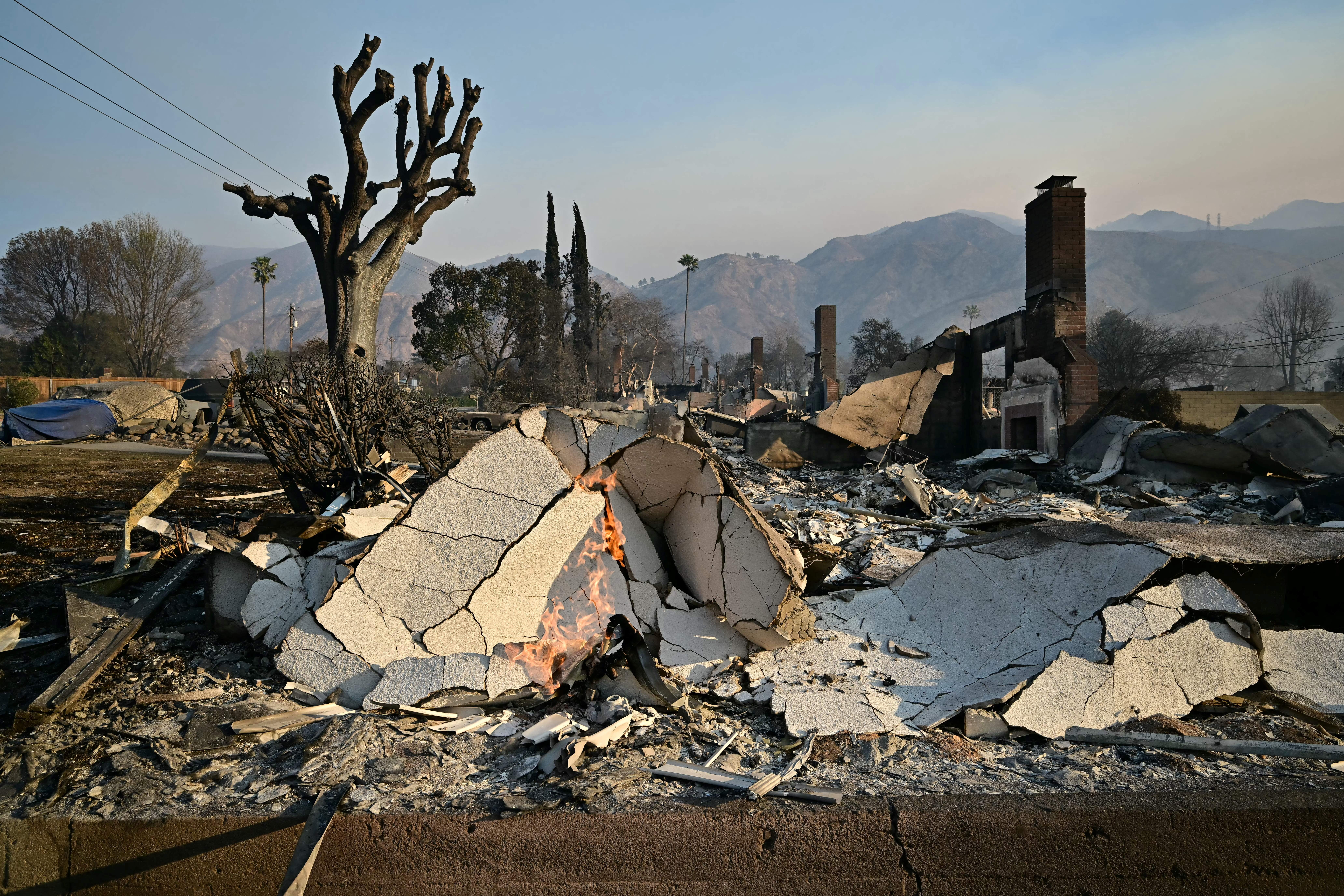 A home reduced to rubble by the Eaton Fire in Altadena, California. Home insurers cannot drop fire victims from their policies for the next year, according to a new state policy