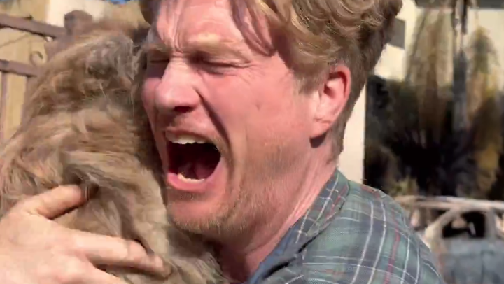 Moment dog owner breaks down in tears after finding pet that went missing for five days in LA wildfires