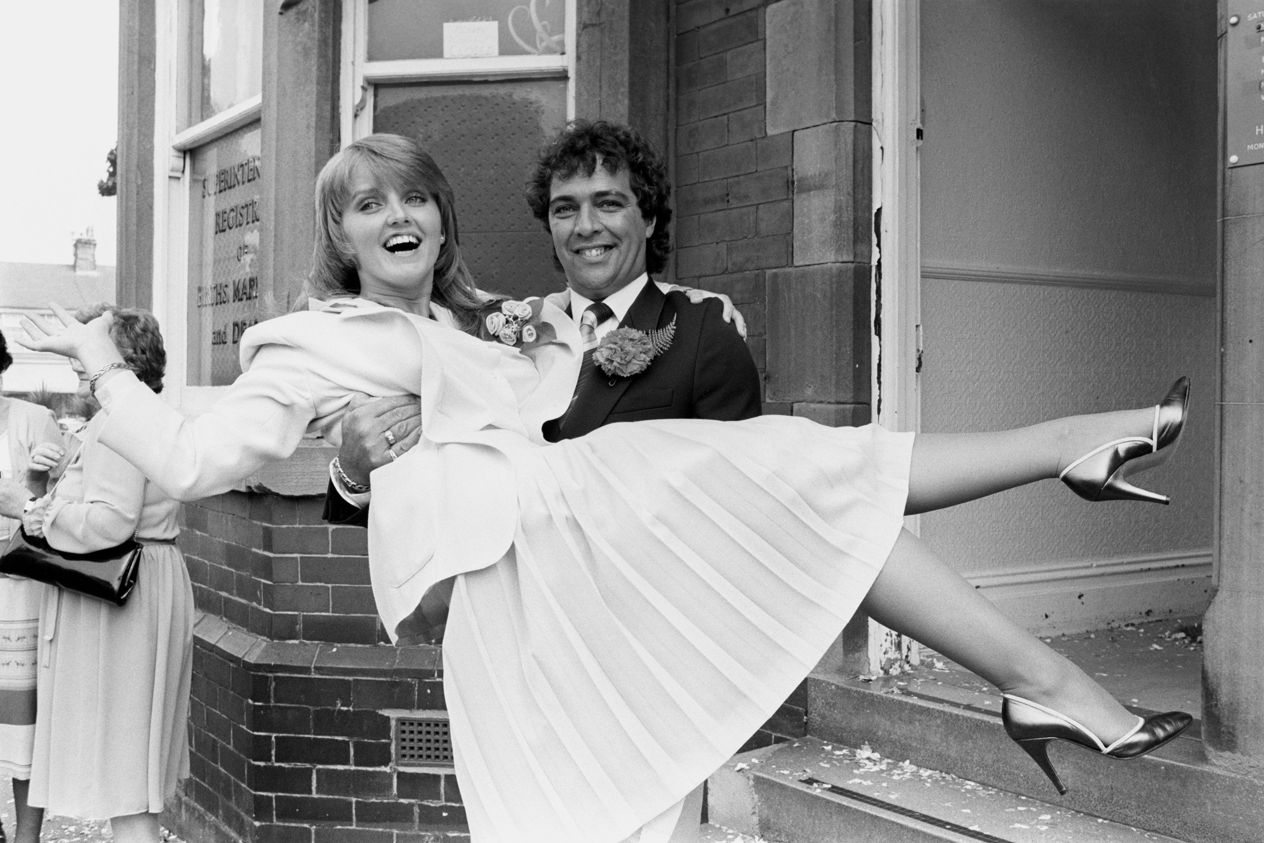 Linda Nolan in the arms of her husband Brian Hudson on their wedding day, 1981