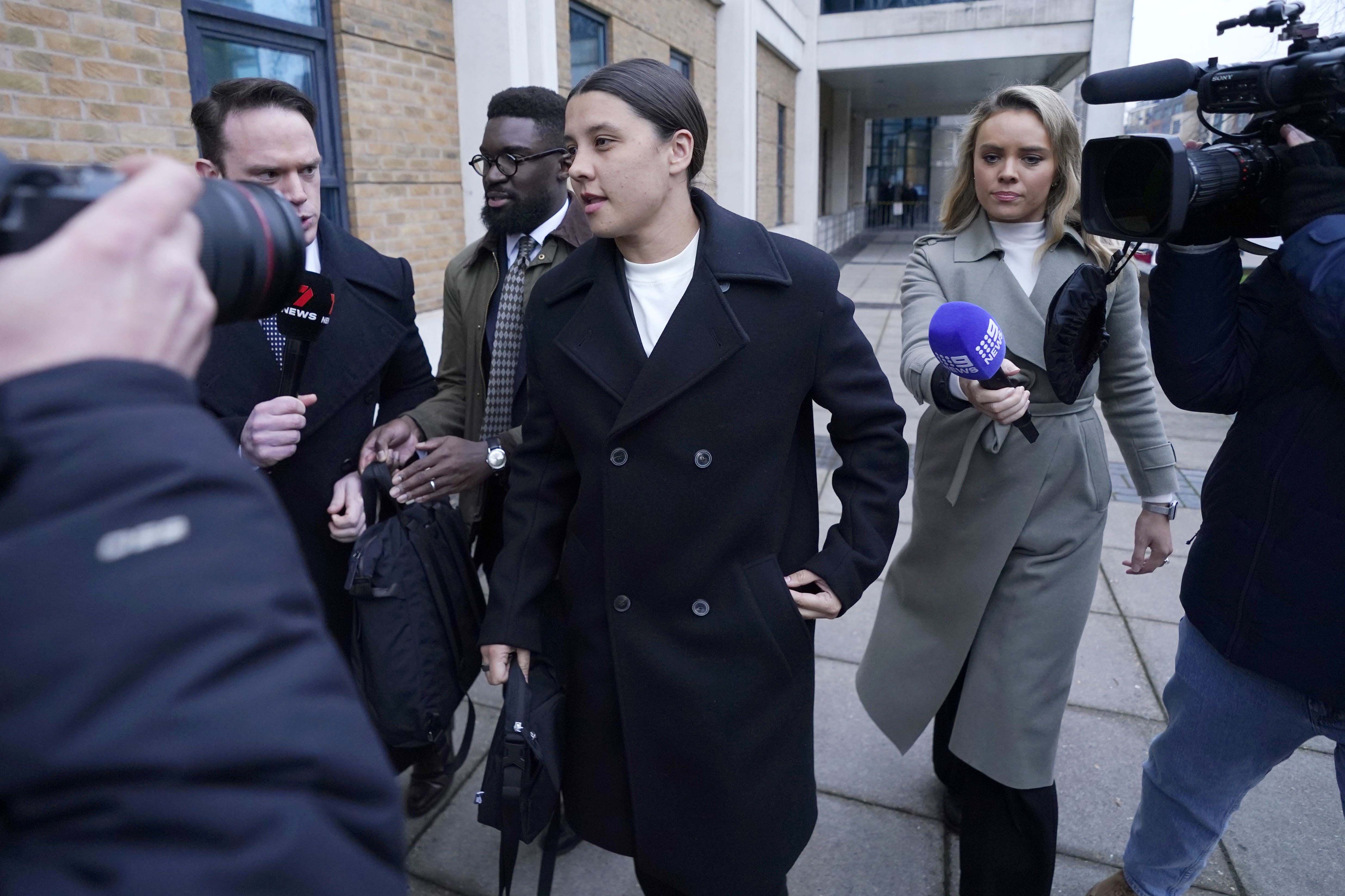 Chelsea striker Sam Kerr (centre) outside Kingston Crown Court, south-west London (Andrew Matthews/PA)