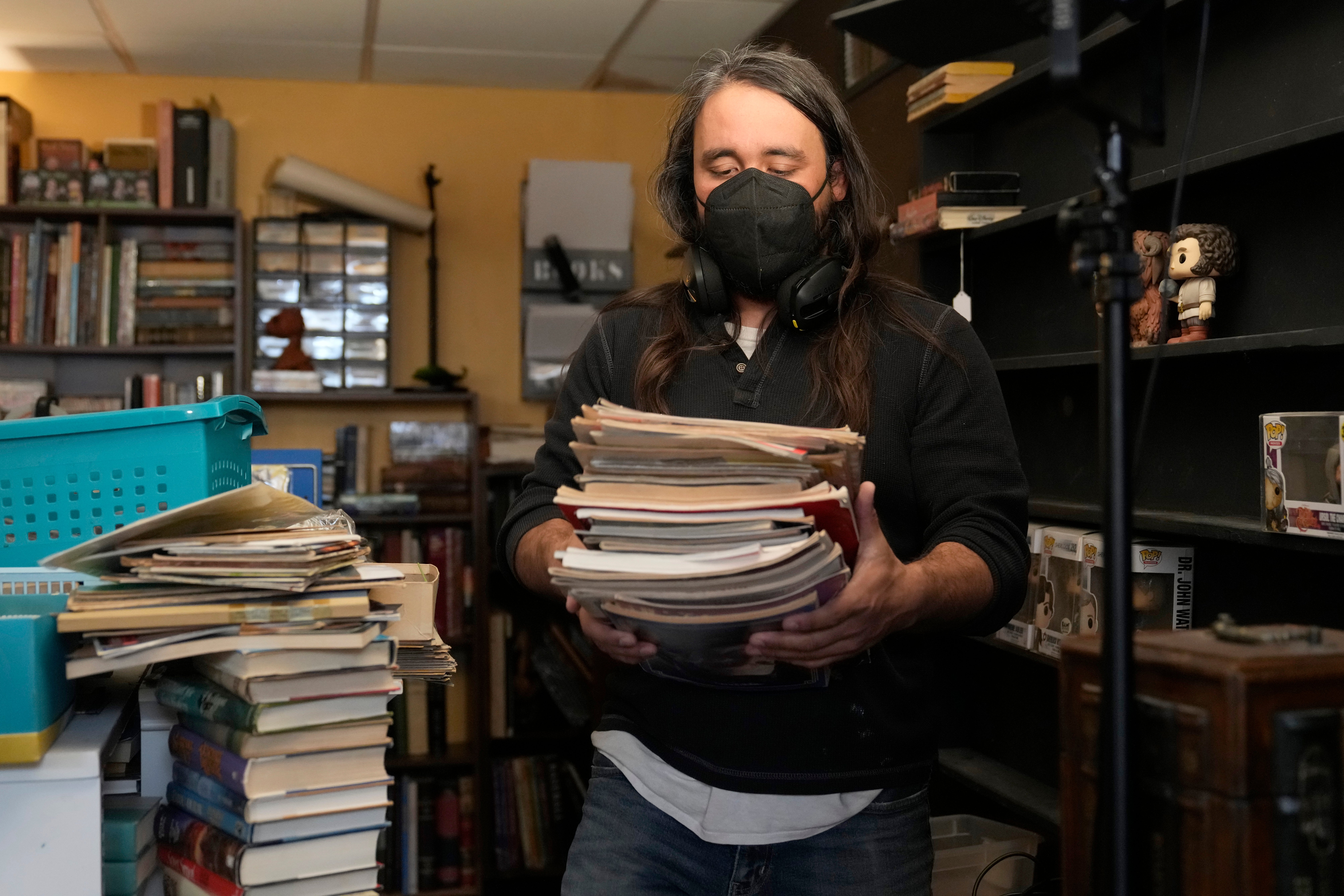 Steve Alejandro works in his office near the room where his wife, Ashley, spends most of her time due to illness in the basement of their home Wednesday, Dec. 18, 2024, in Wentzville, Mo