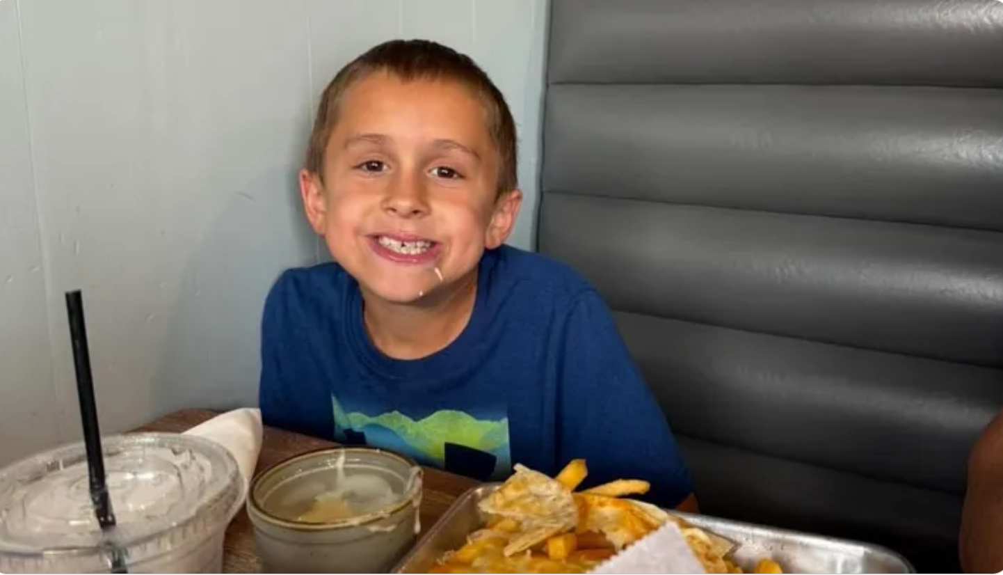 A photo of Michael Millett, an eight-year-old boy who was mauled and killed by a pair of dogs near his home in Volusia County, Florida, on January 13
