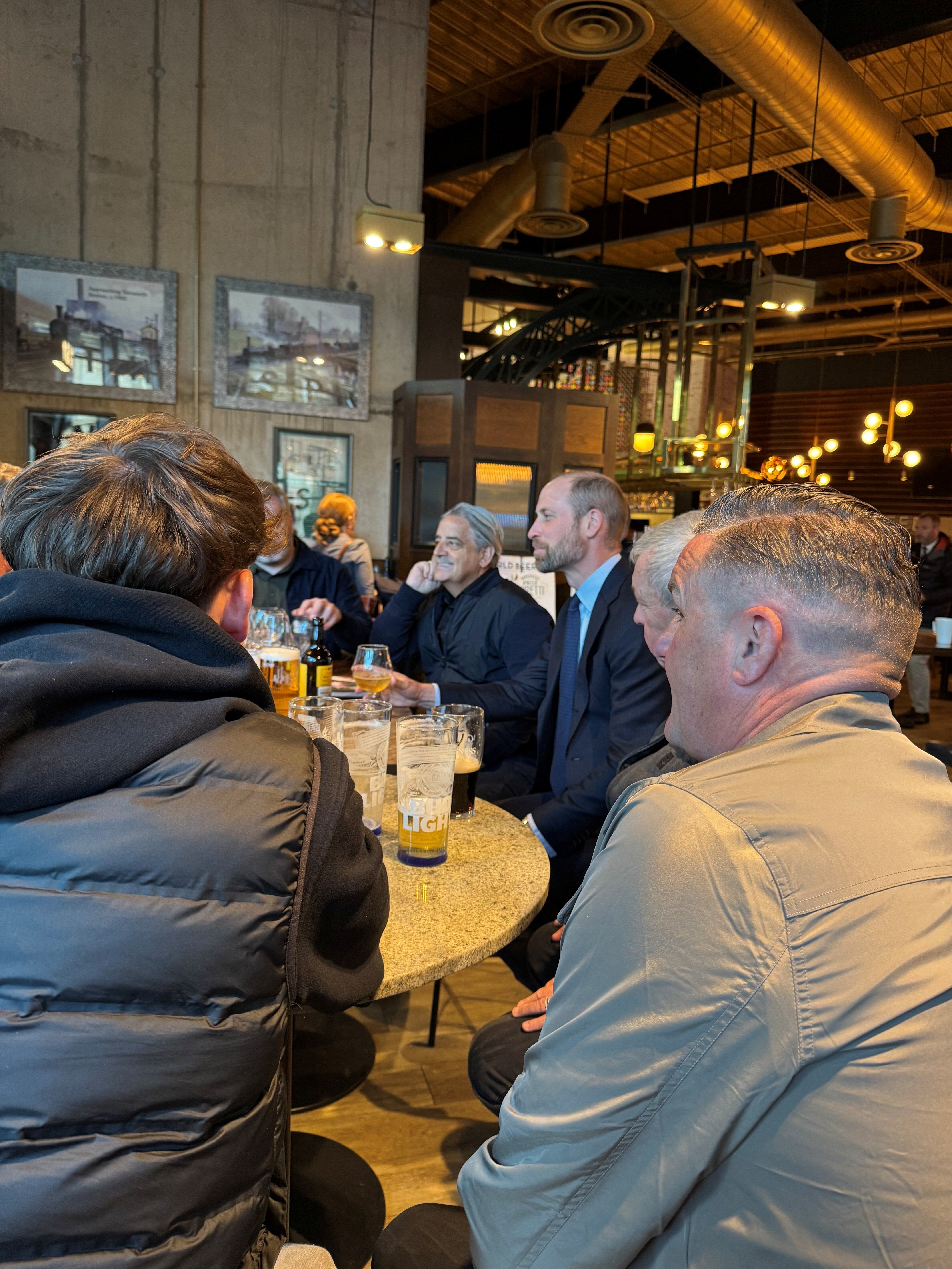 The Prince of Wales meeting Aston Villa supporters in a Wetherspoons pub in the centre of Birmingham (Daniel Jones/PA)