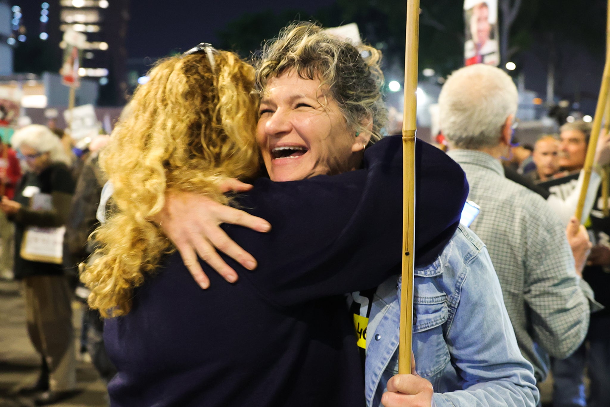 Israelis in Tel Aviv celebrate news that a ceasefire has been agreed